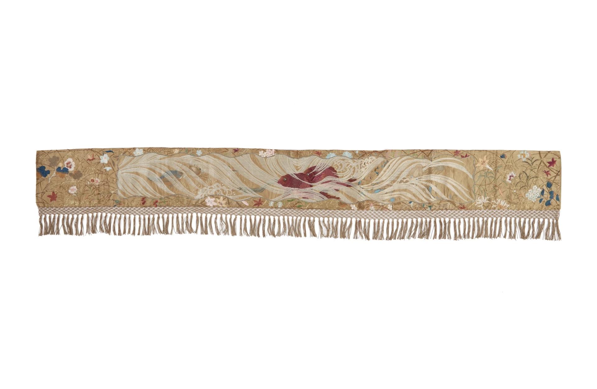 Japanese mantel piece in gold silk satin with a blue silk lining hanging with fringe.