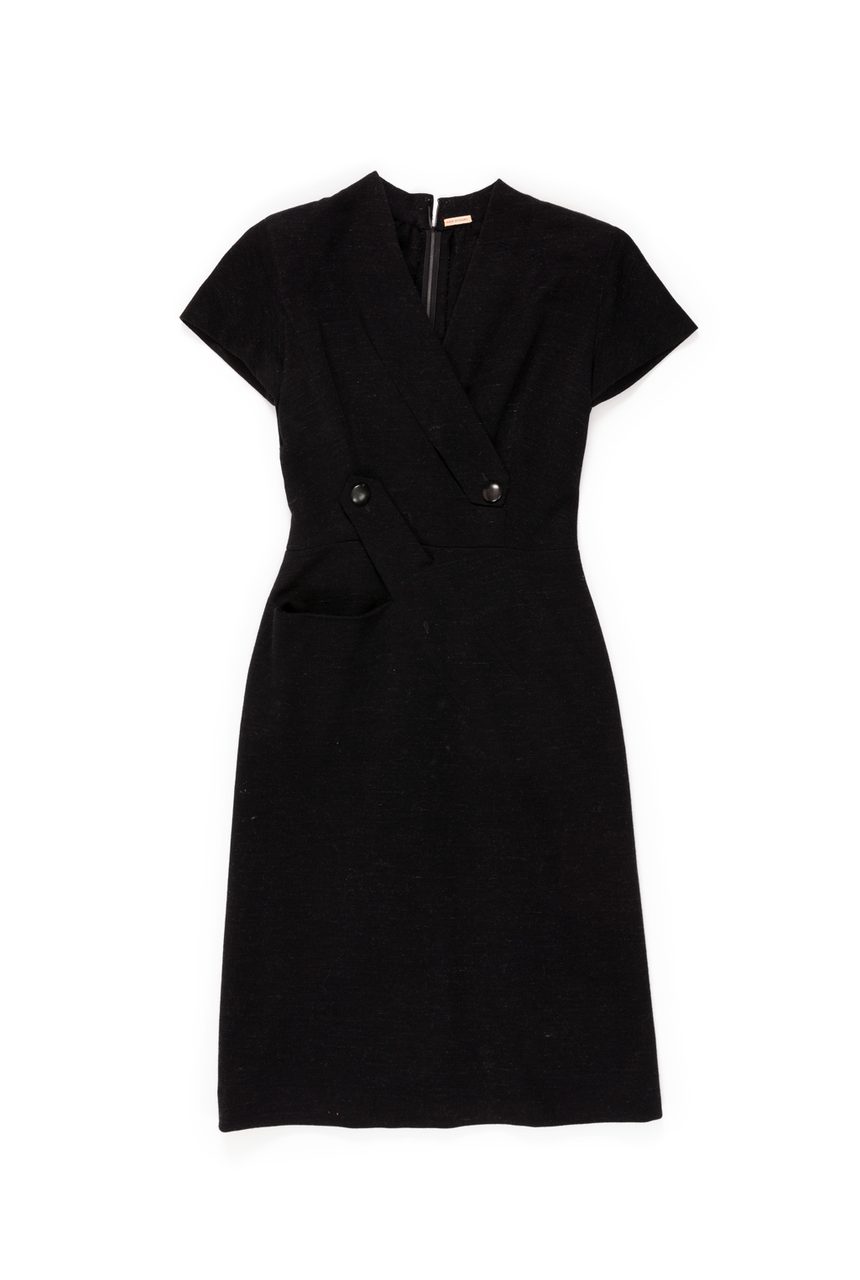 Black dress with a high neckline, short sleeves, and two big buttons along the waist.