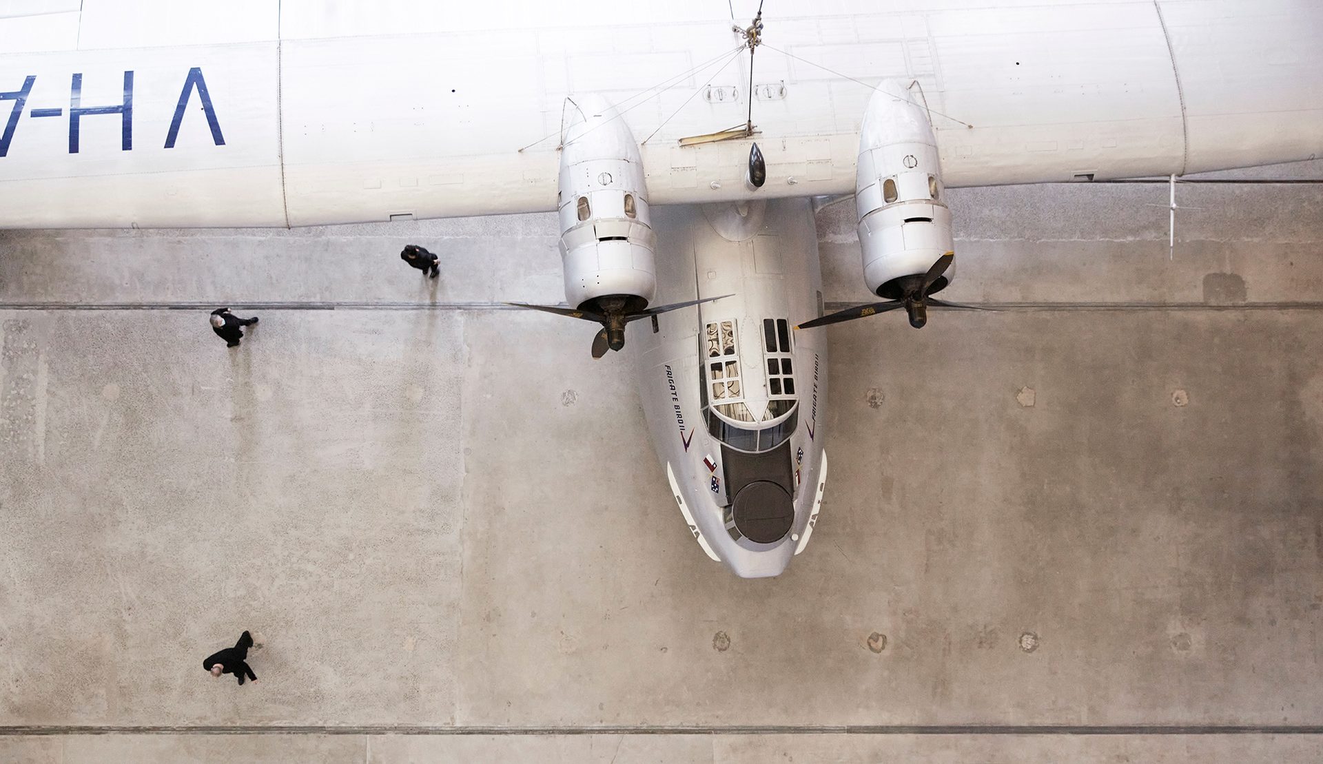 Aerial view of nose and wingspan of silver plane, Catalina Frigate Bird II