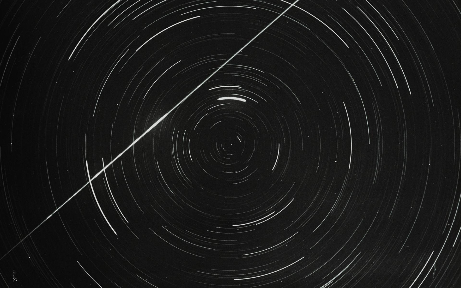 Lantern slide of meteor and star trails.