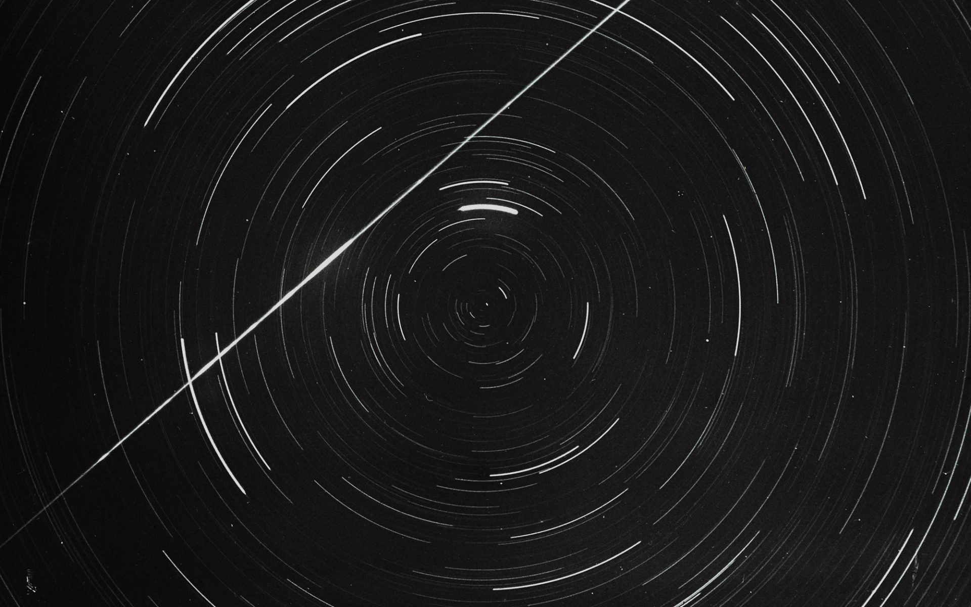 Lantern slide of meteor and star trails.