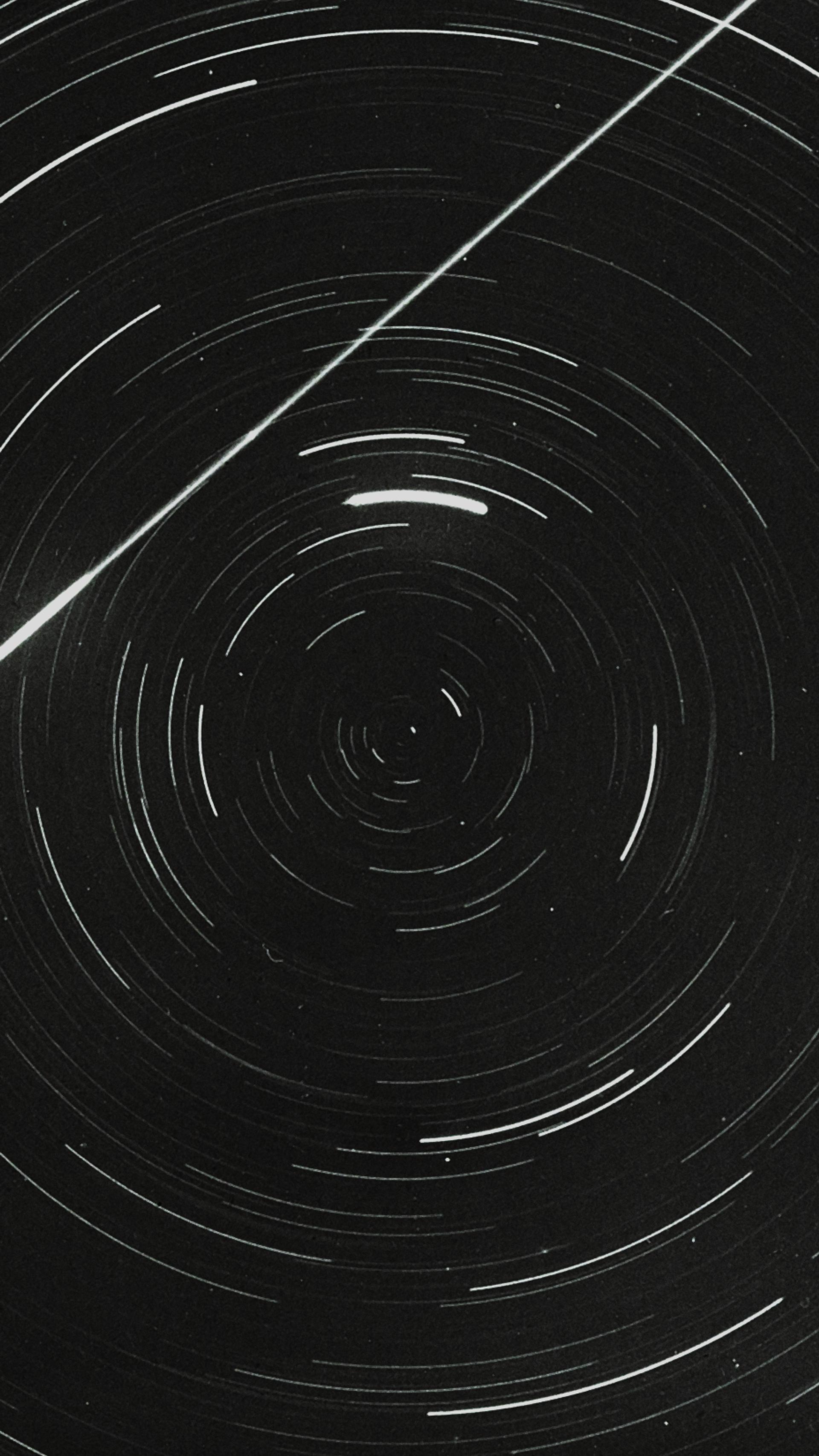 Lantern slide of meteor and star trails.