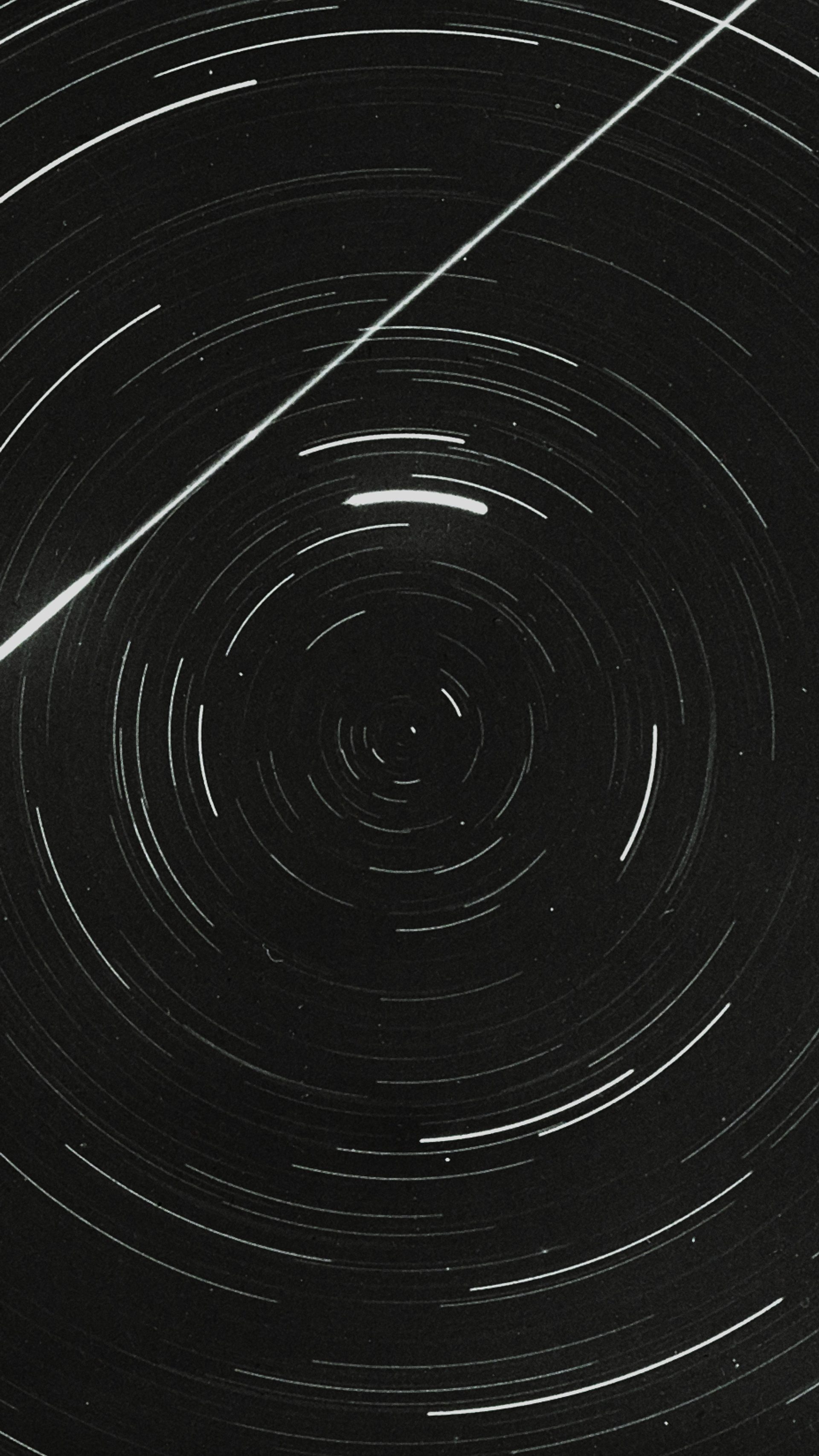 Lantern slide of meteor and star trails.