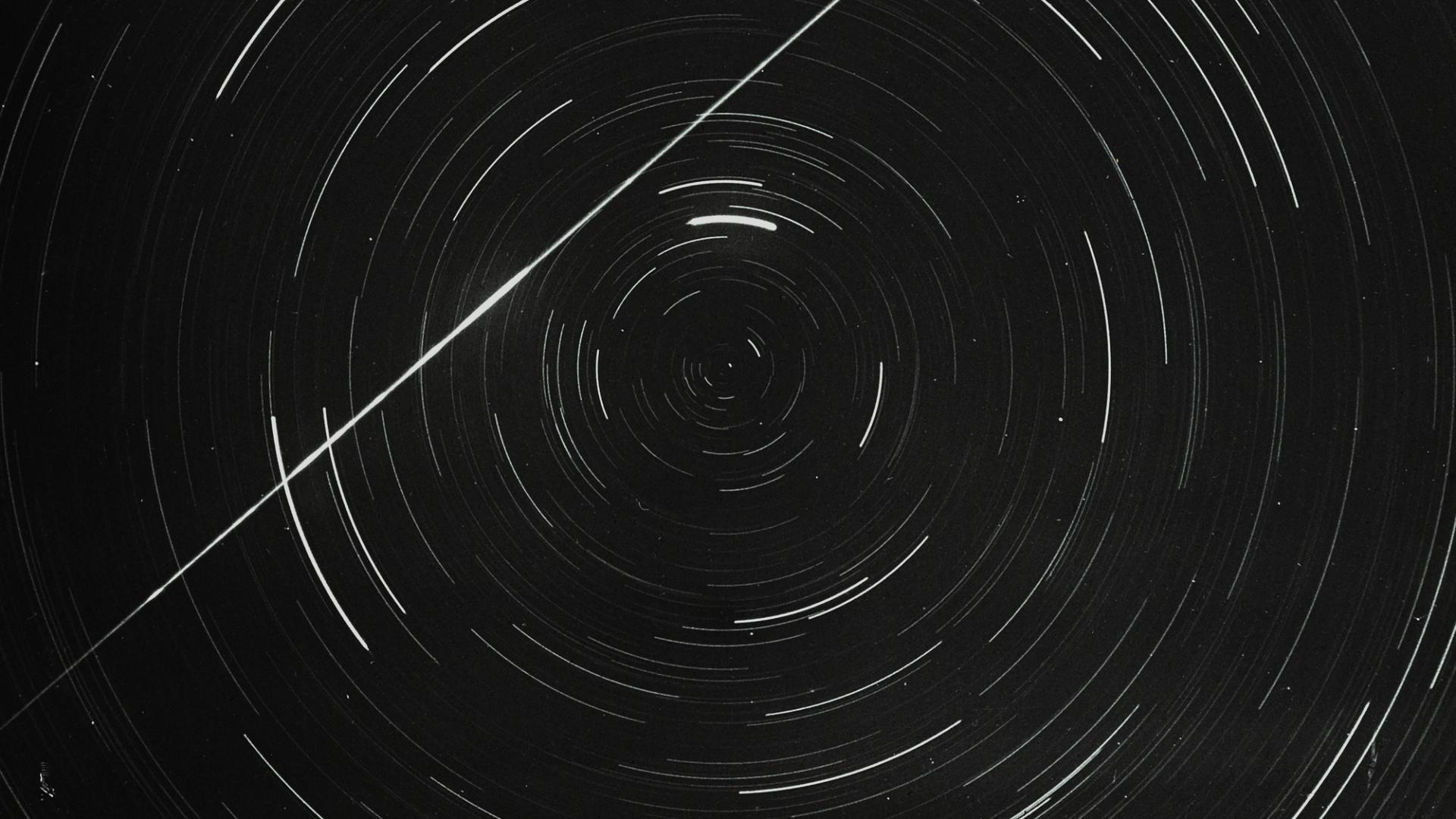 Lantern slide of meteor and star trails.