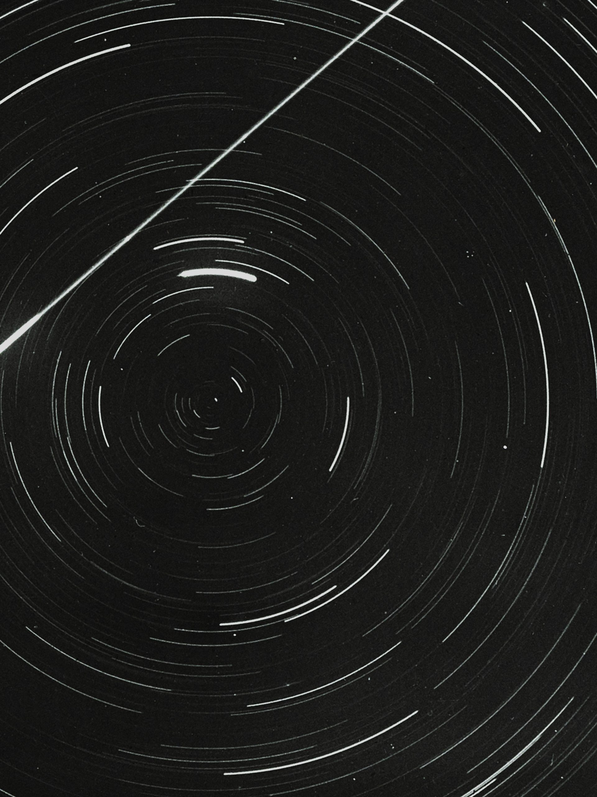 Lantern slide of meteor and star trails.
