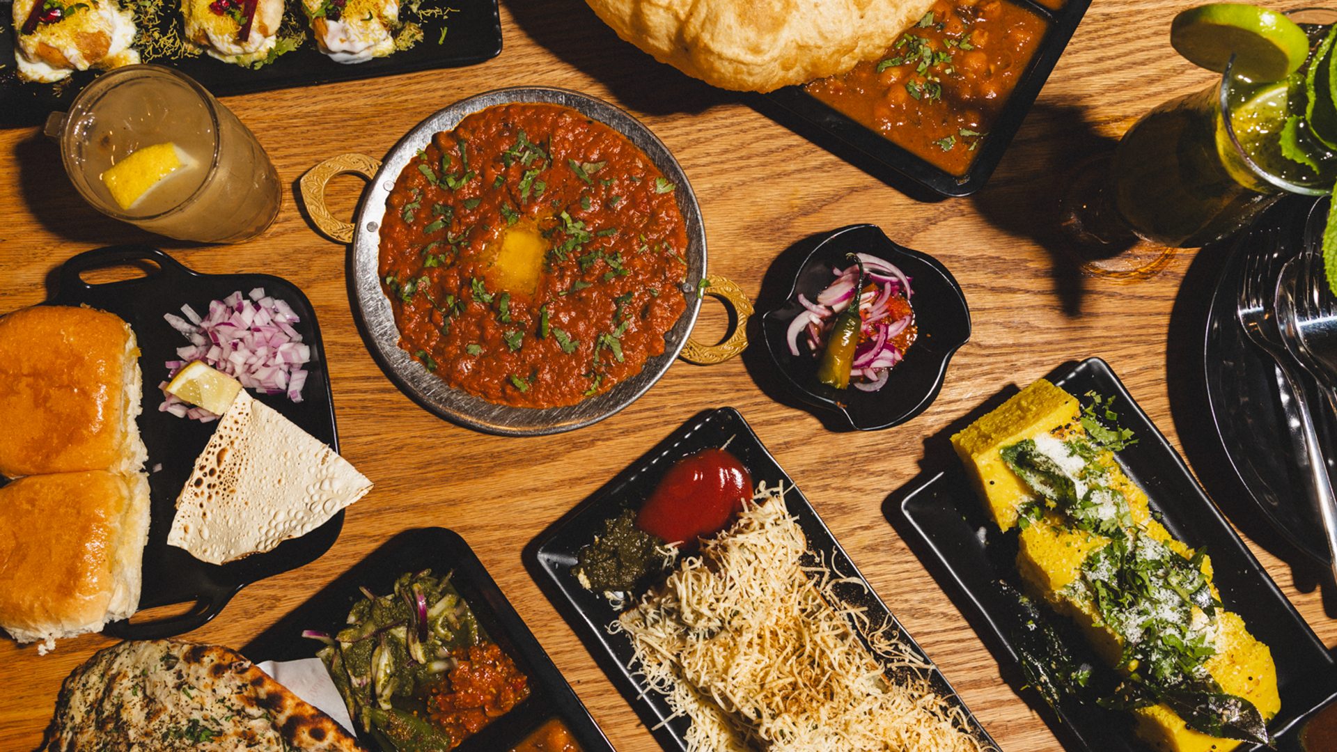 Tabled filled with plates of food.