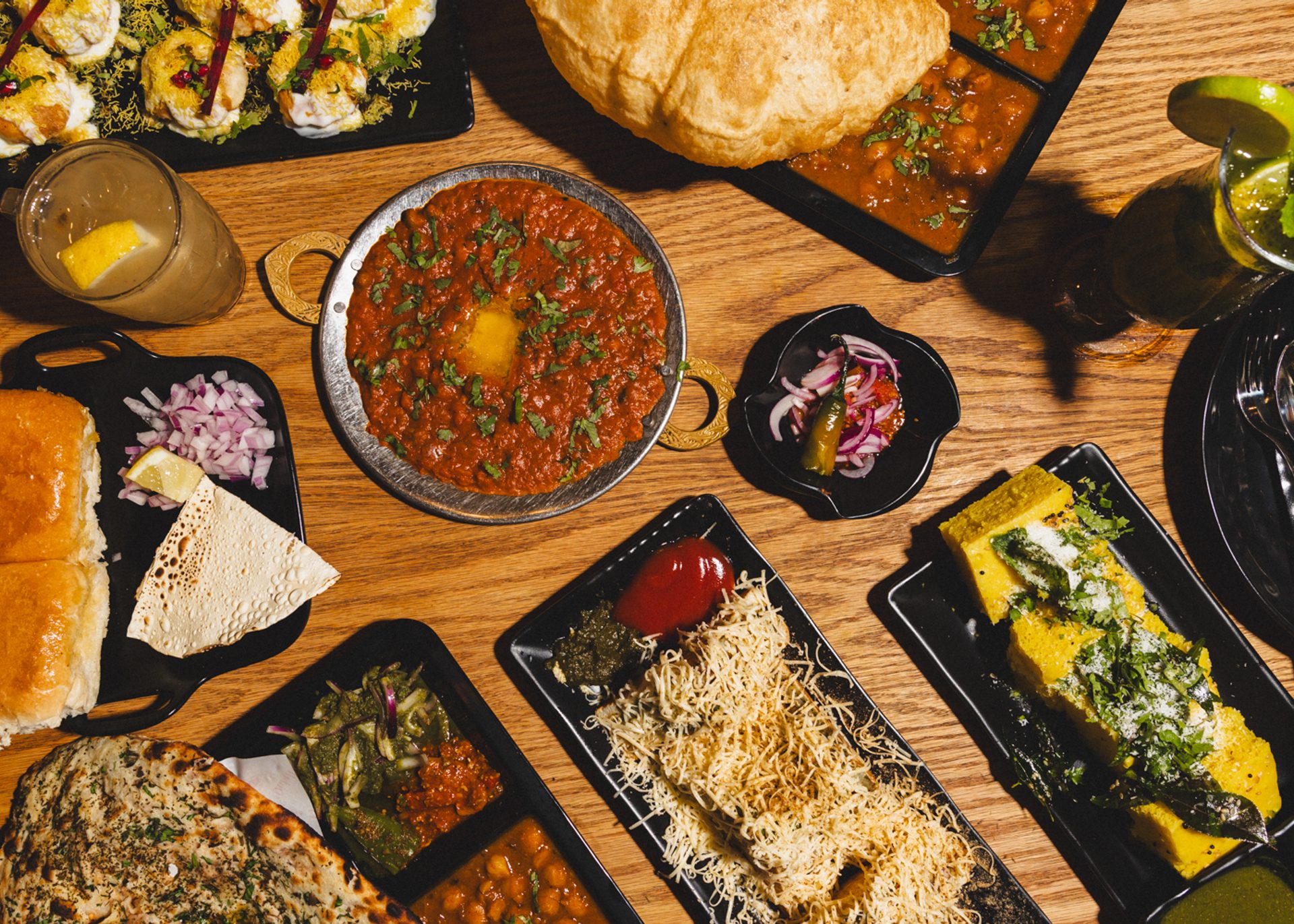Tabled filled with plates of food.