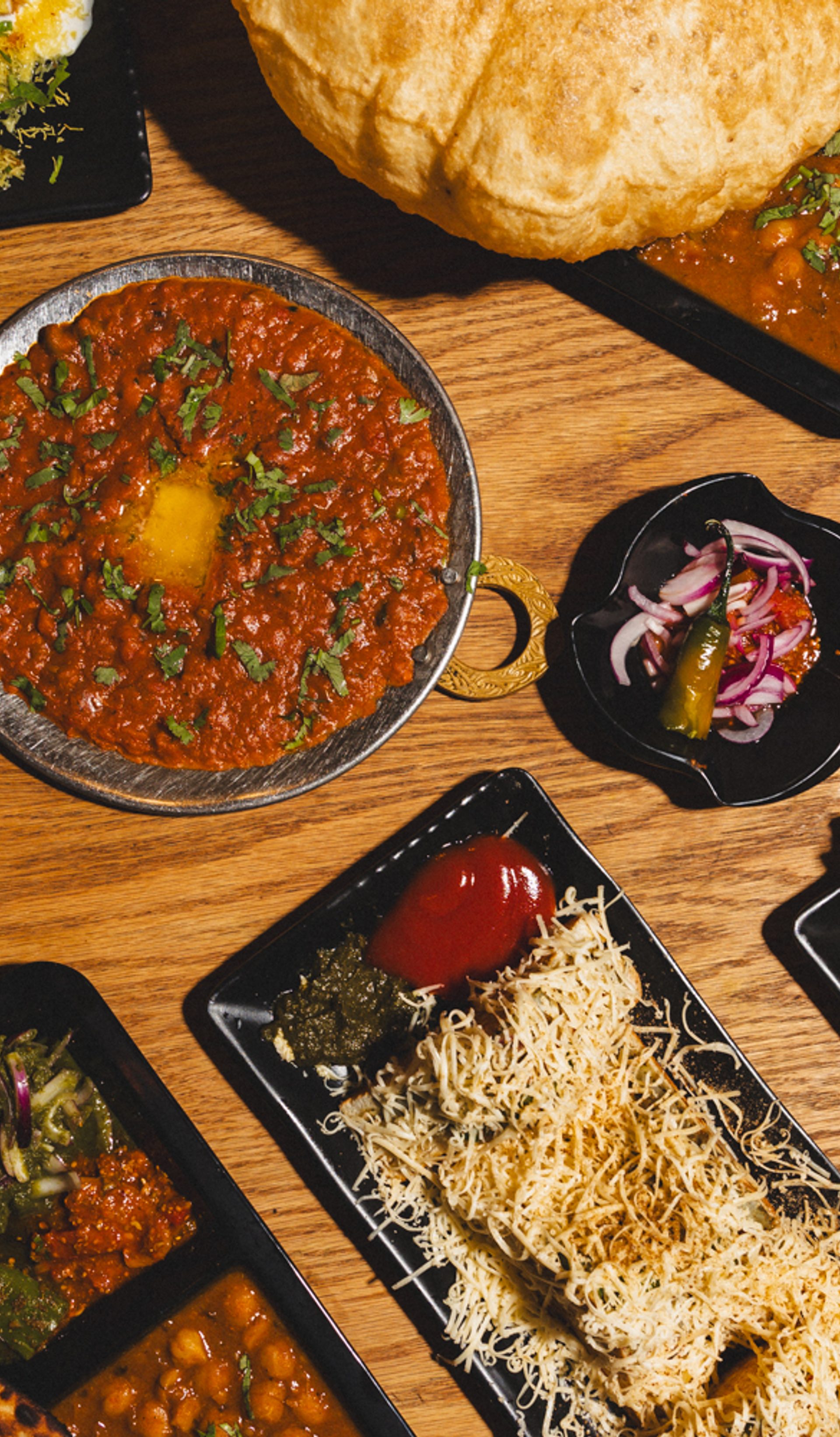 Tabled filled with plates of food.