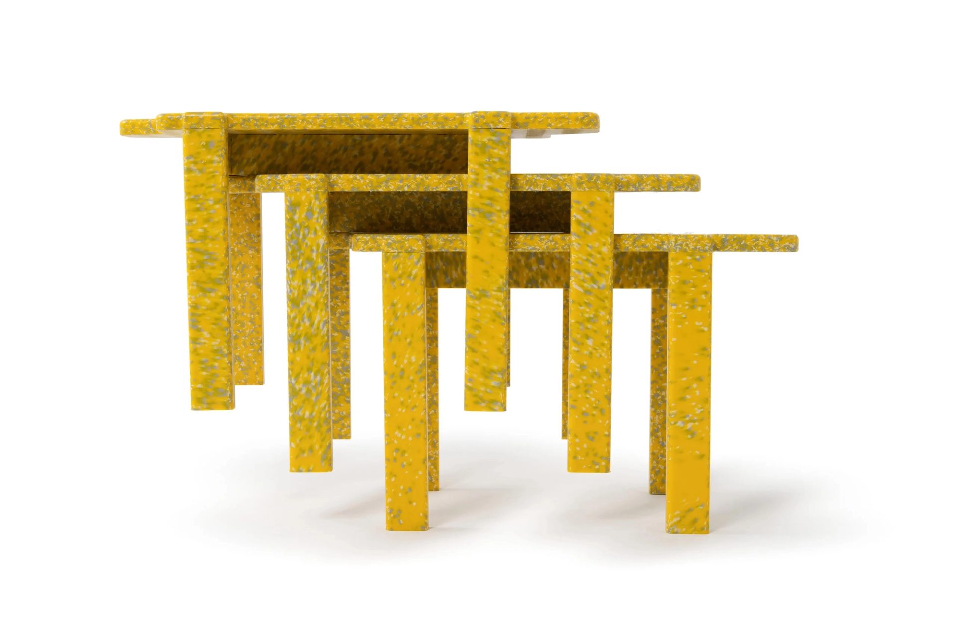 Three yellow stools stacked atop each other diagonally
