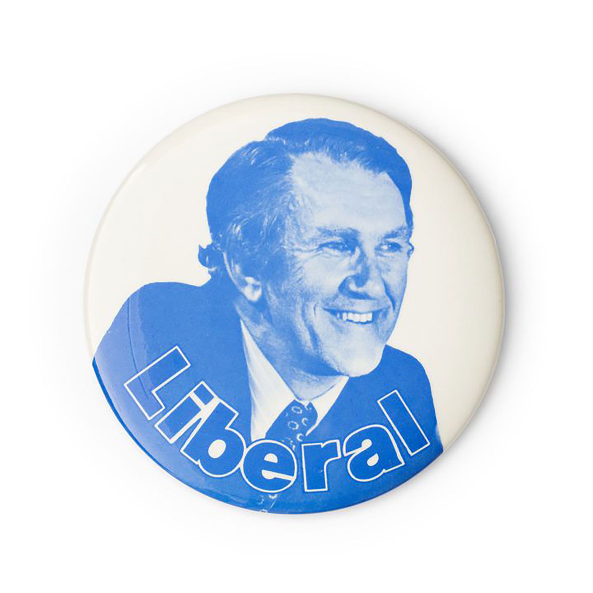 White badge with a blue tinted image of Malcolm Fraser. ‘Liberal’ is written at the bottom of the badge.