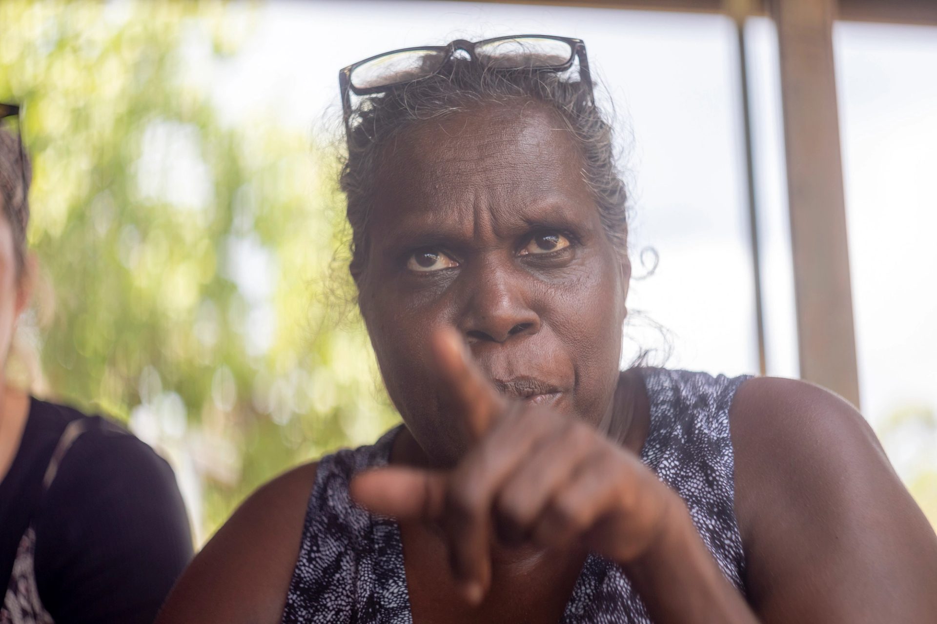 A woman pointing at the camera