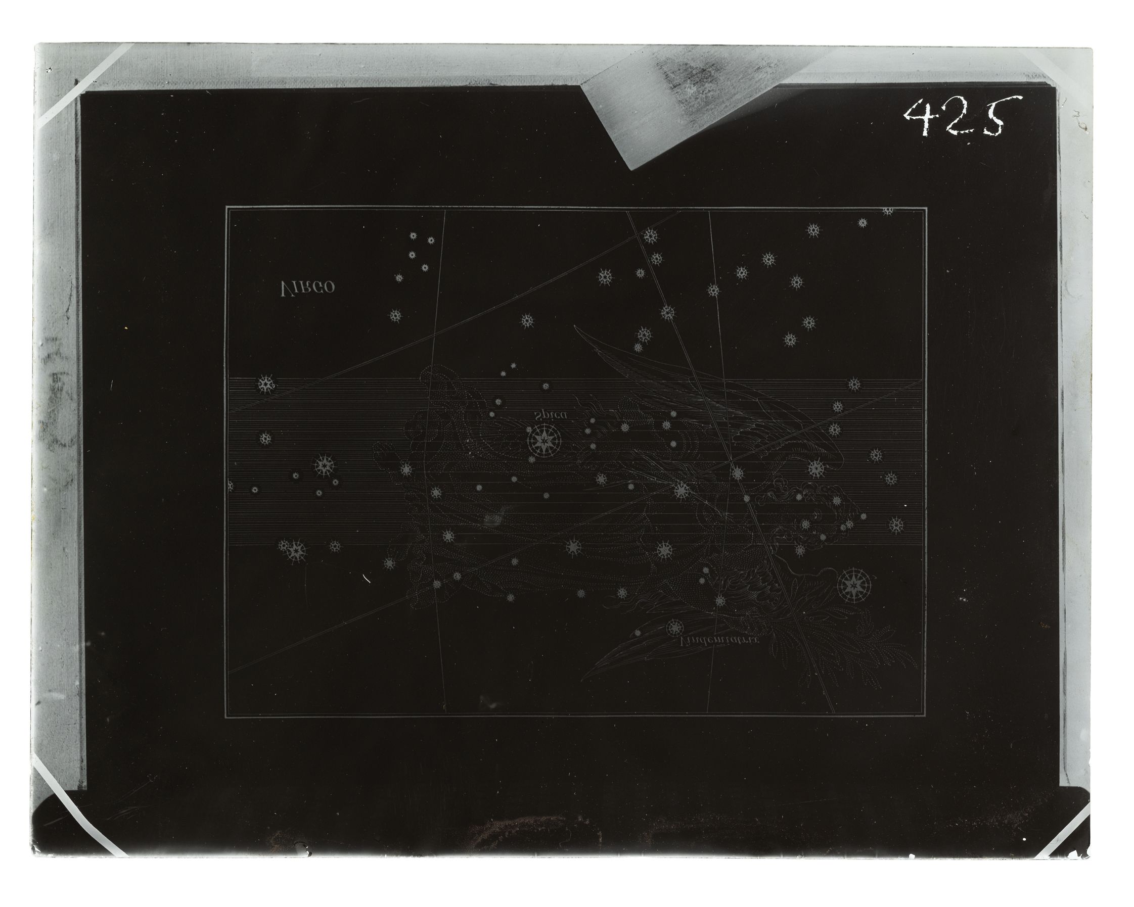 Photograph of a plate negative made of glass, showing an astrological constellation map of Virgo