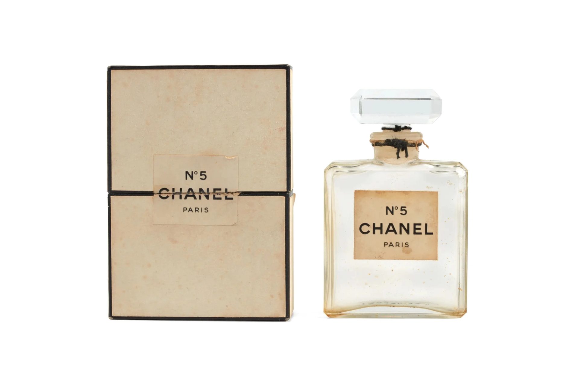 Photograph of a large perfume bottle and box, 'No 5' by Chanel.