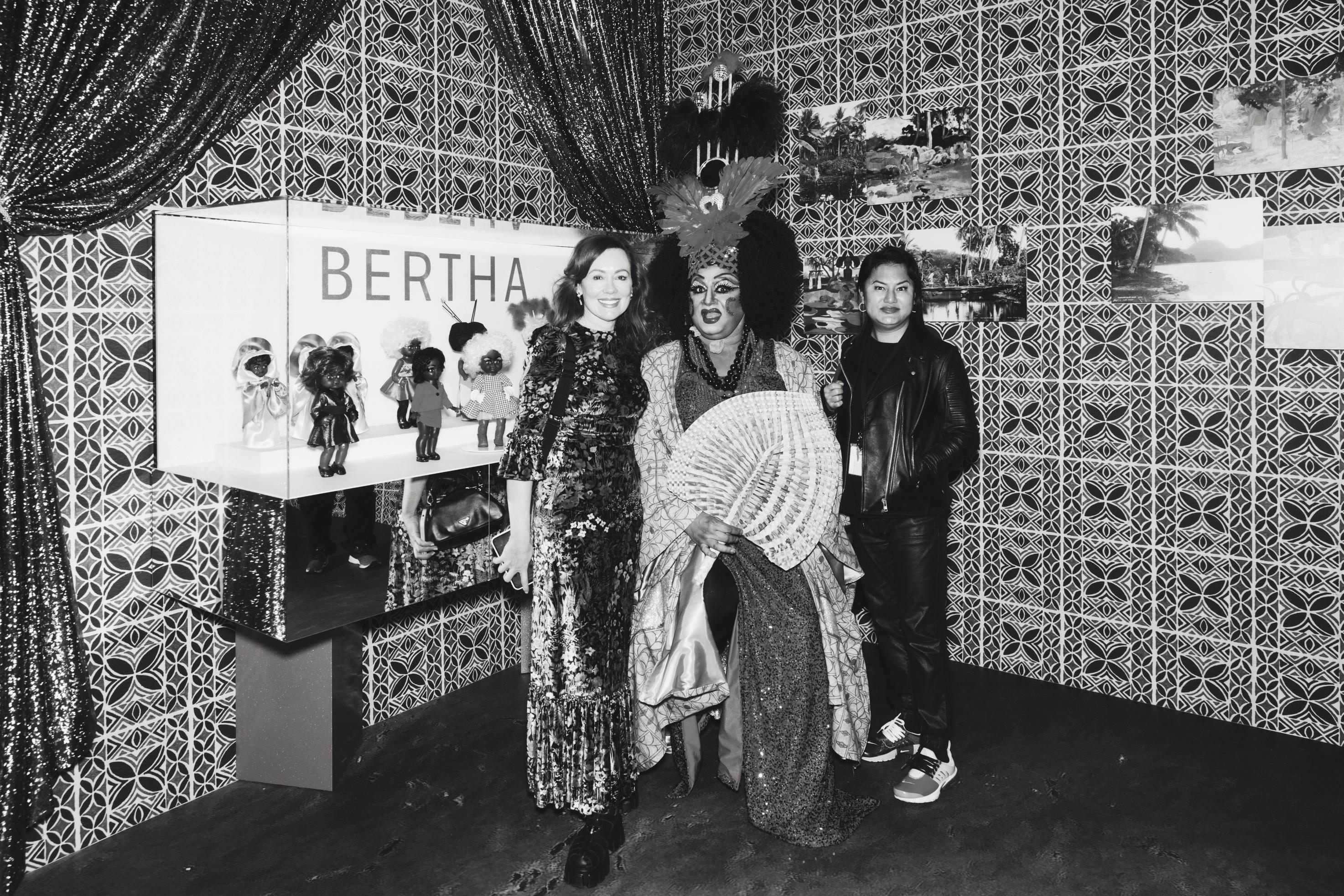 Three people stand in front of the BERTHA exhibition installation at the Powerhouse Museum, Ultimo.