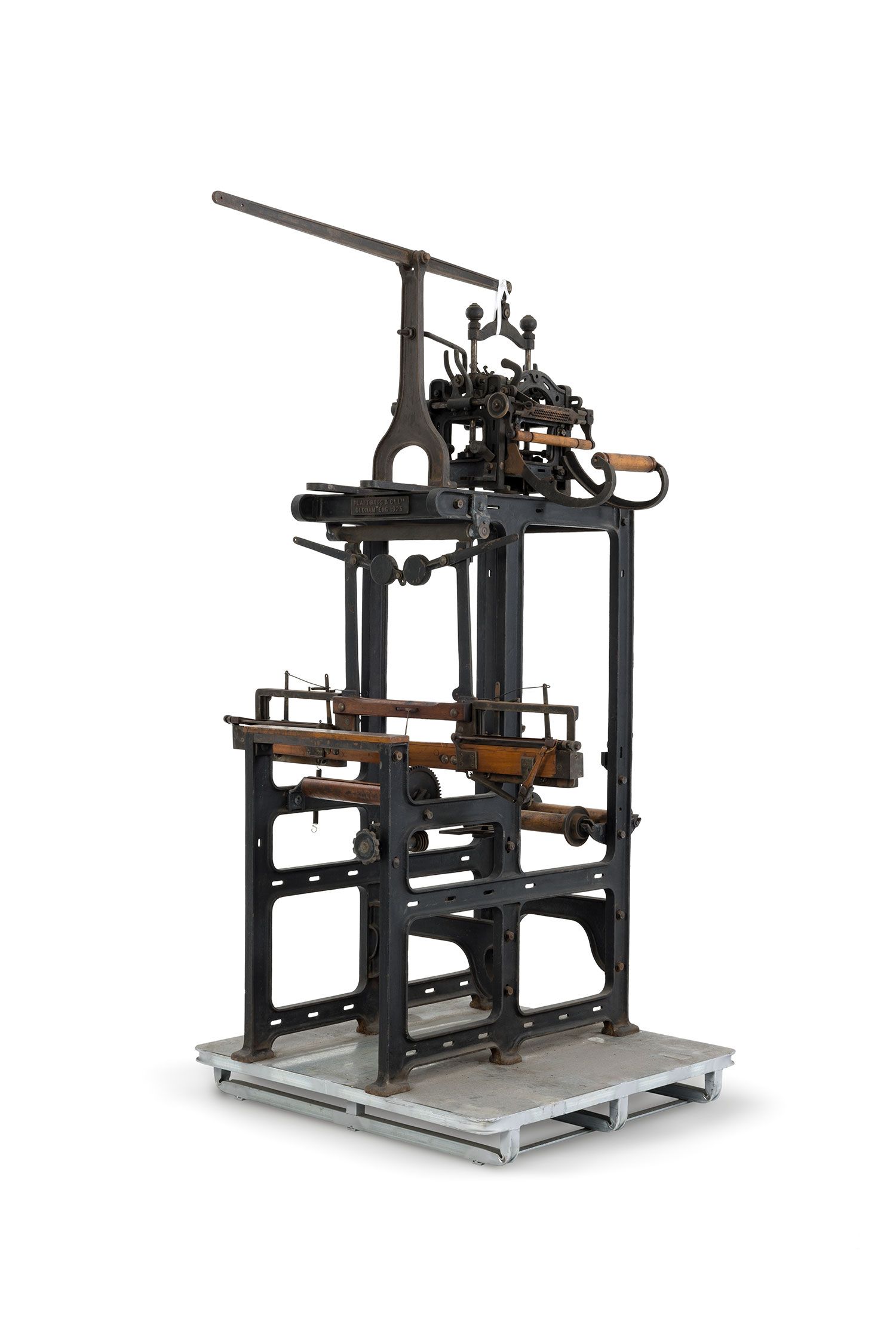 A metal and wood loom with matching stool.