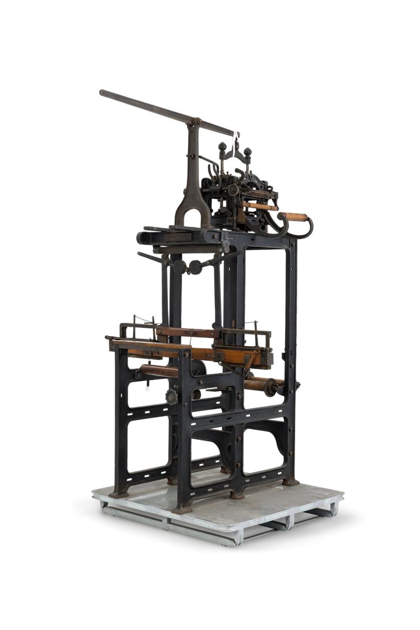 A metal and wood loom with matching stool.