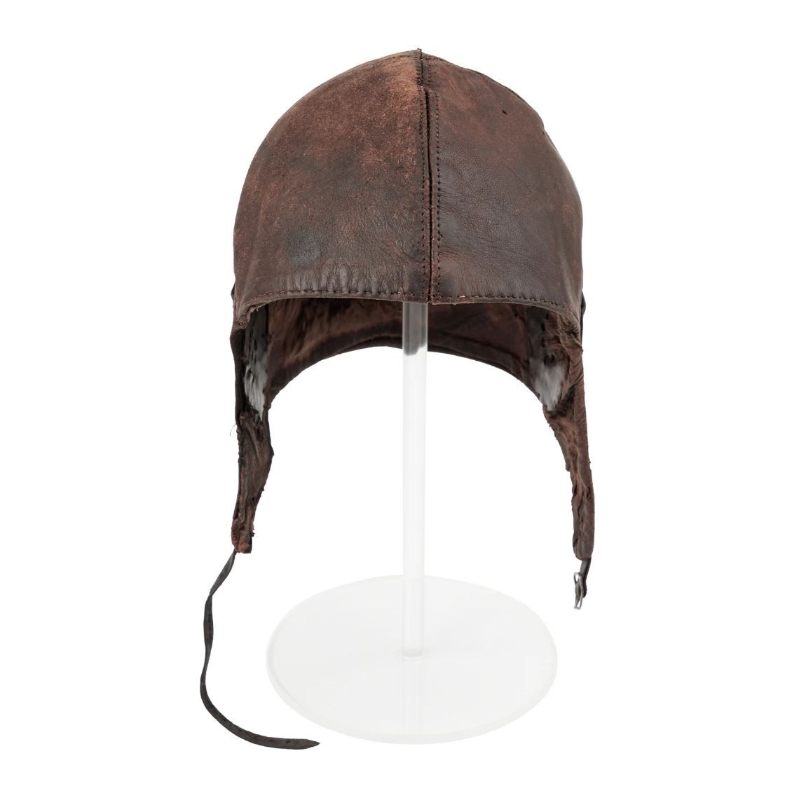 Flying helmet with loose strap.