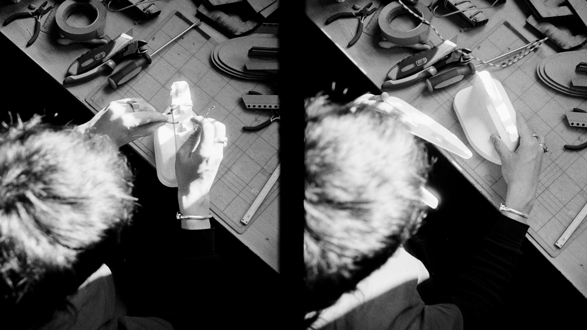 Two film images side by side – an overhead view of Ben Styles working on a product at a desk.