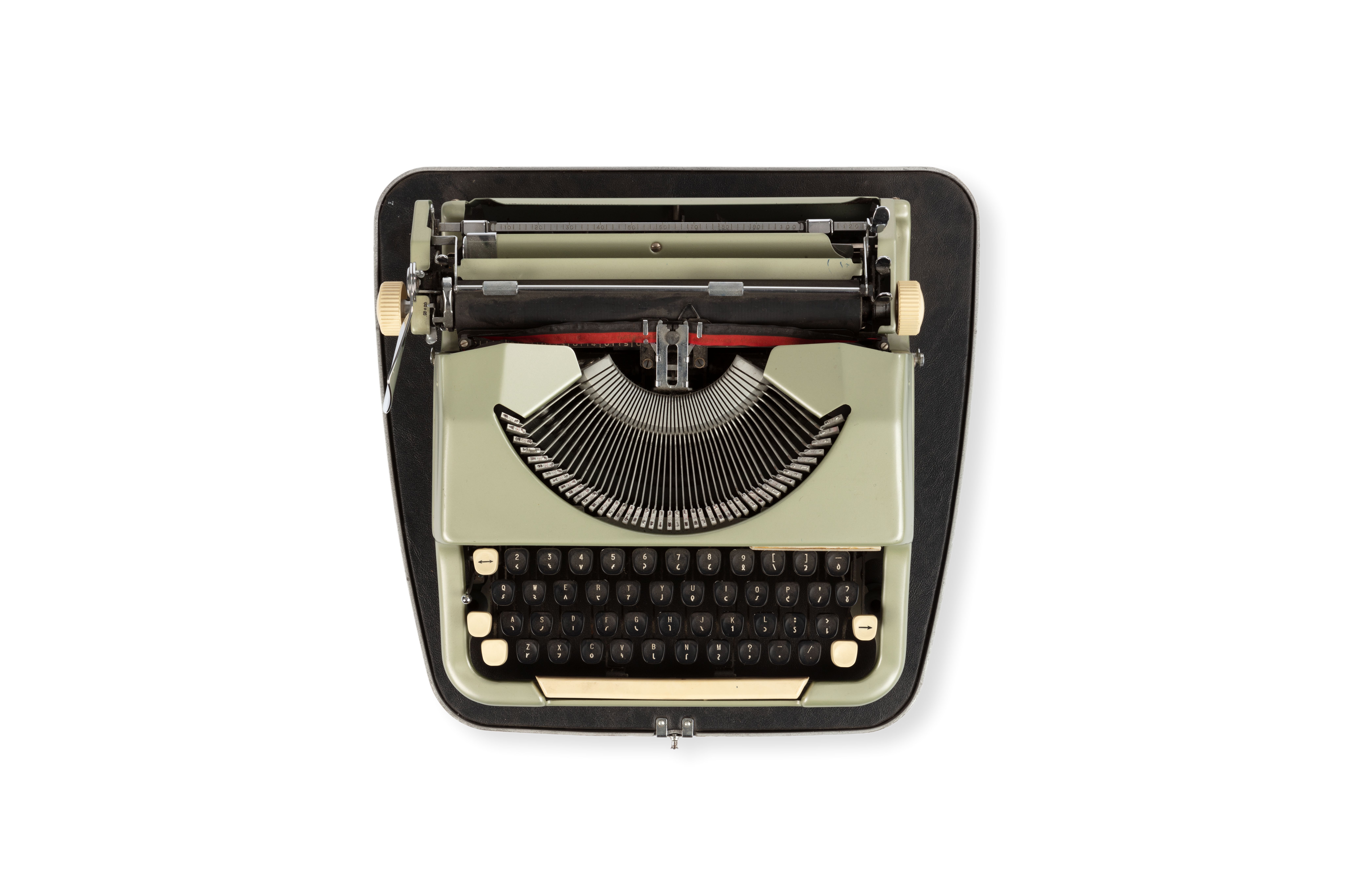 Photograph of a typewriter 'Imperial-good companion' which types in the Shavian alphabet. It has a metal base with a light green body. The keys have two markings on each key, set out in the QWERTY system.