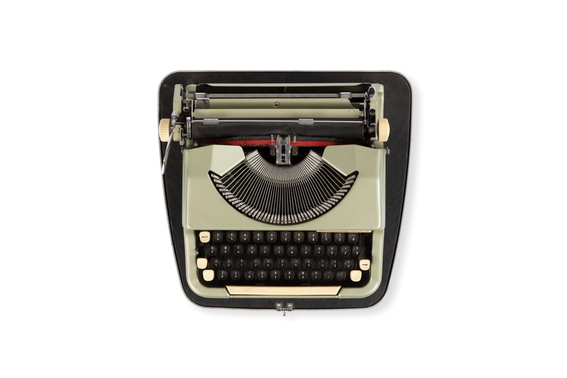 Photograph of a typewriter 'Imperial-good companion' which types in the Shavian alphabet. It has a metal base with a light green body. The keys have two markings on each key, set out in the QWERTY system.