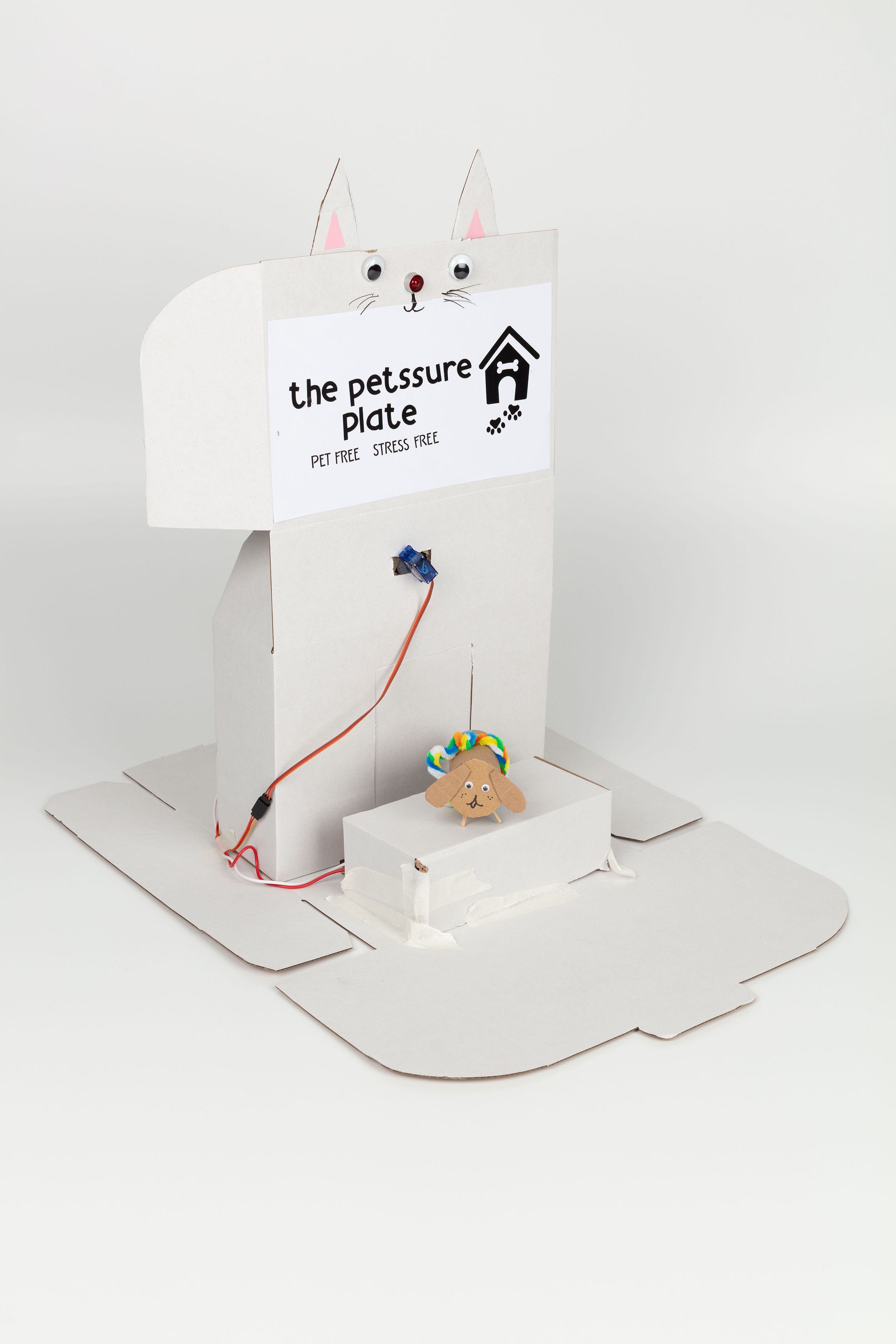 Image of a hand crafted mechanical device against a white background.