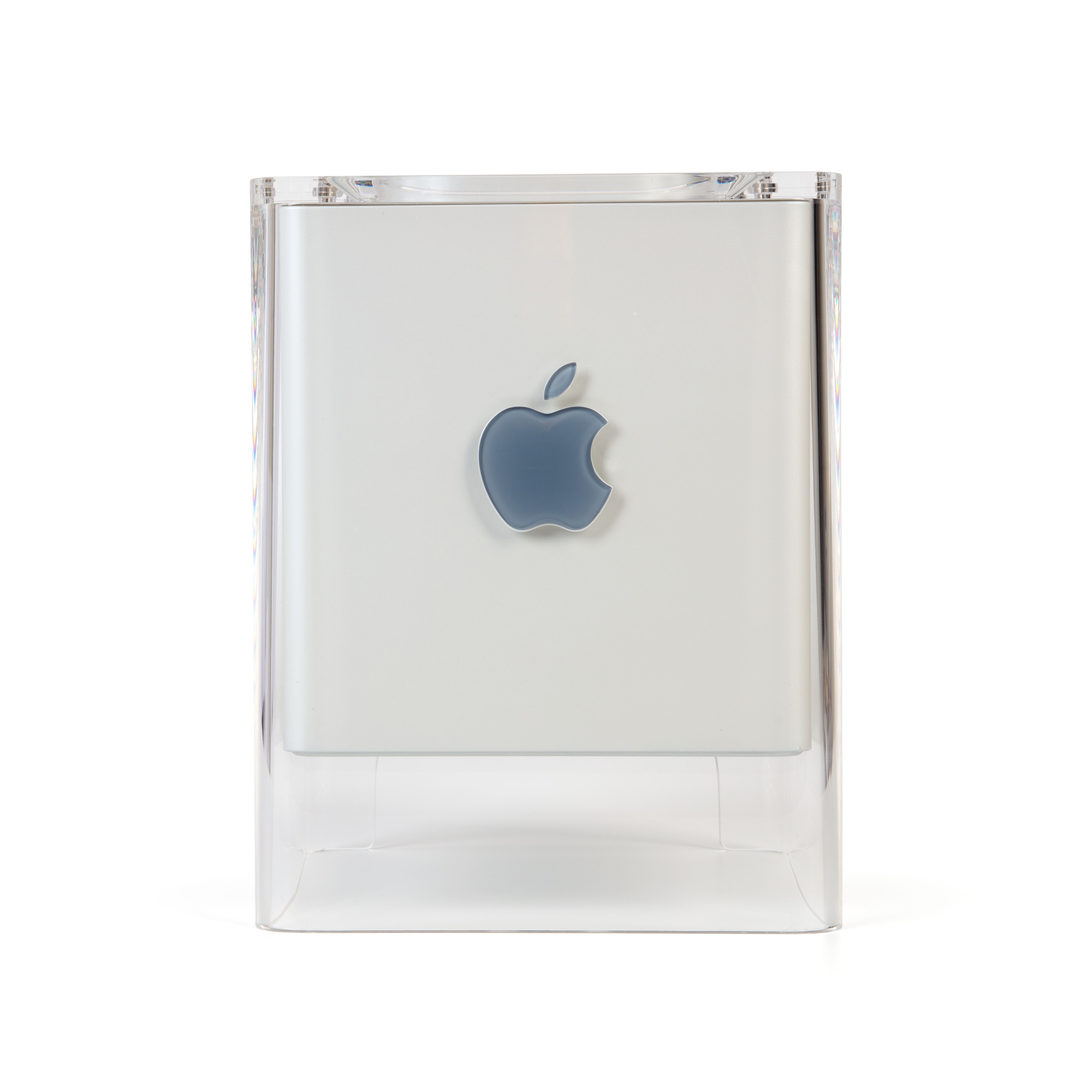 The Power Mac G4 Cube consists of a grey coloured plastic cube within a clear acrylic support with four legs that that extend below the internal cube to support it over the working surface, allow for cable access and to enable ventilation by convection.