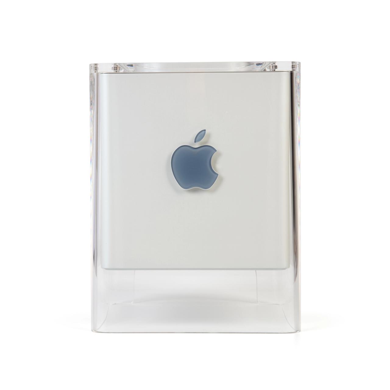 The Power Mac G4 Cube consists of a grey coloured plastic cube within a clear acrylic support with four legs that that extend below the internal cube to support it over the working surface, allow for cable access and to enable ventilation by convection.