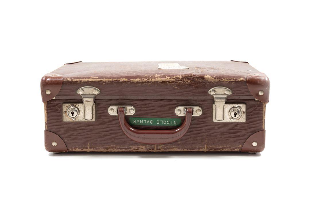 brown leather-looking briefcase with silver clips