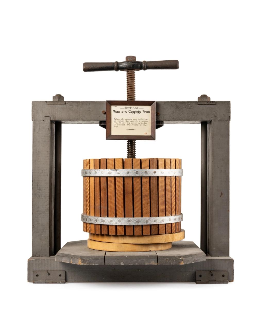 Beekeeping equipment, combined wax and cappings press, made of timber and metal.