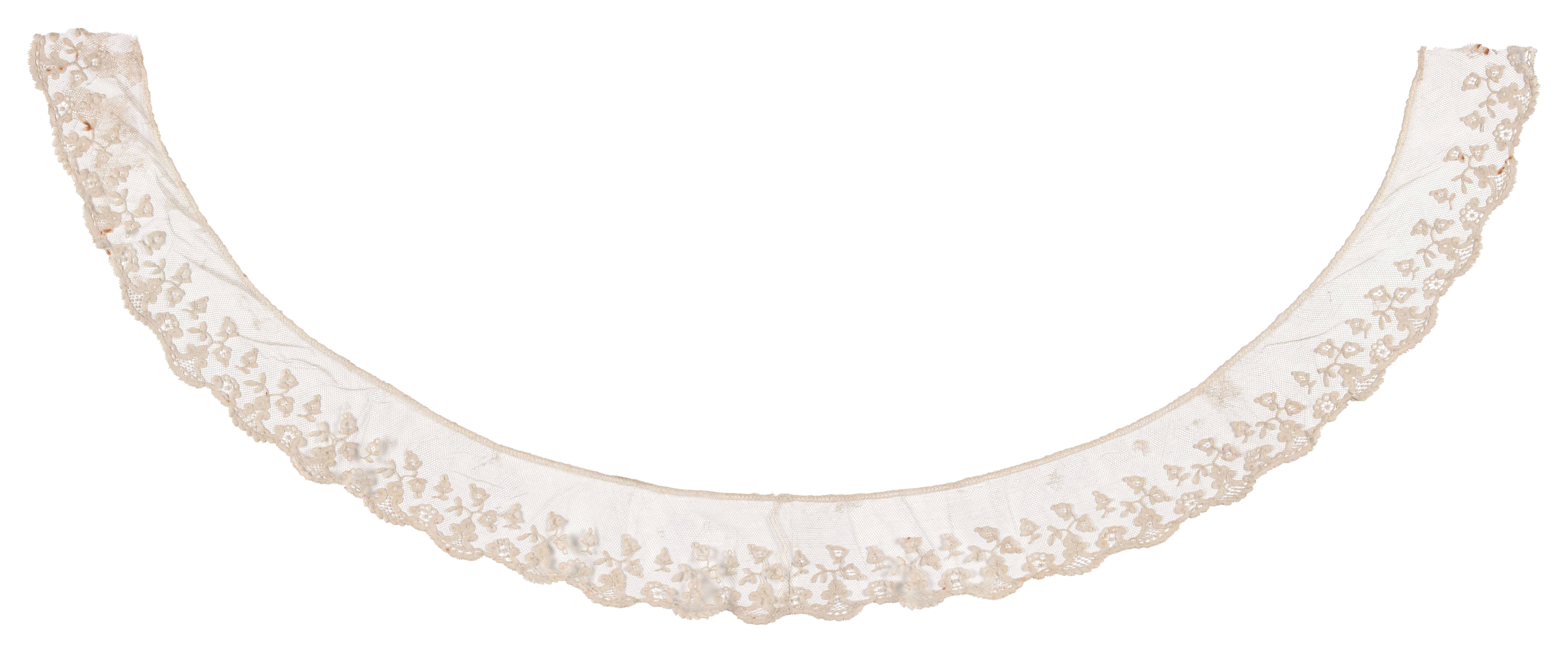 A lace collar, bobbin applique on machine made net with needle lace filling, made of cotton. Horseshoe in shape the collar features a scrolling floral design with a scalloped edge and machine made bobbin engrelure. The collar is made using cloth stitch bobbin lace motifs appliqued to machine made net. The design is embellished with needle lace fillings. Lace collar is made of cotton.