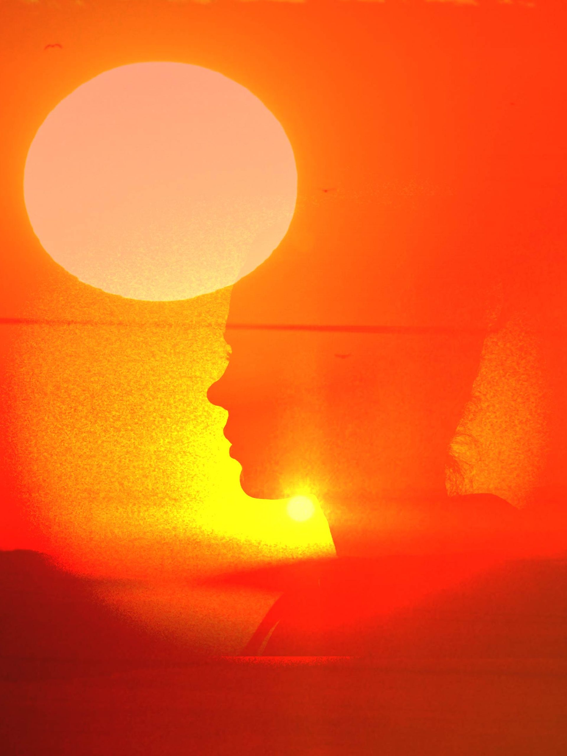 Overlay of sunset with a silhouette.