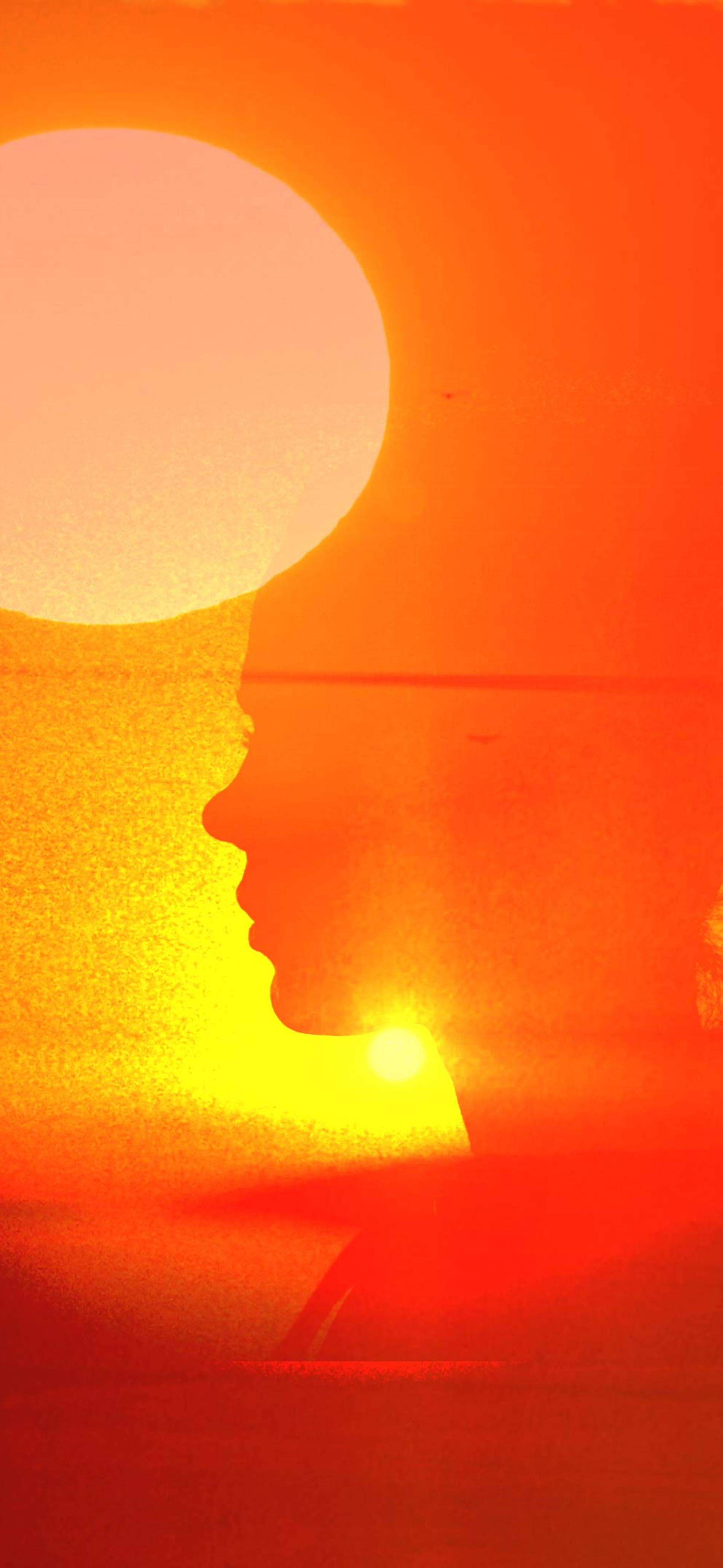 Overlay of sunset with a silhouette.