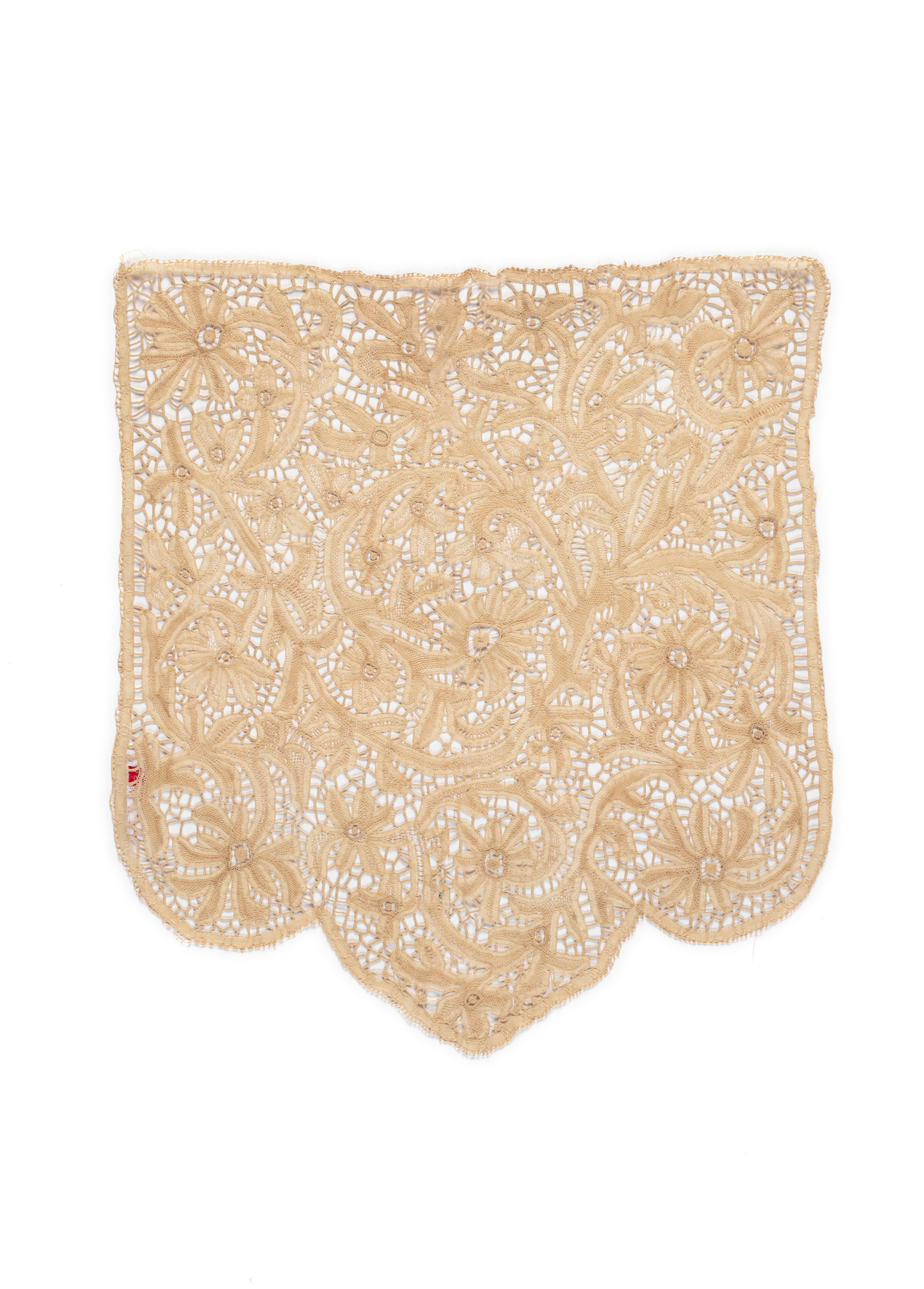 Tape lace banner screen, with the bottom of the lace forming scolloped edges, the design features floral and foliate motifs, the outside border of the banner is composed of a larger decorative tape, with a needle lace edging.