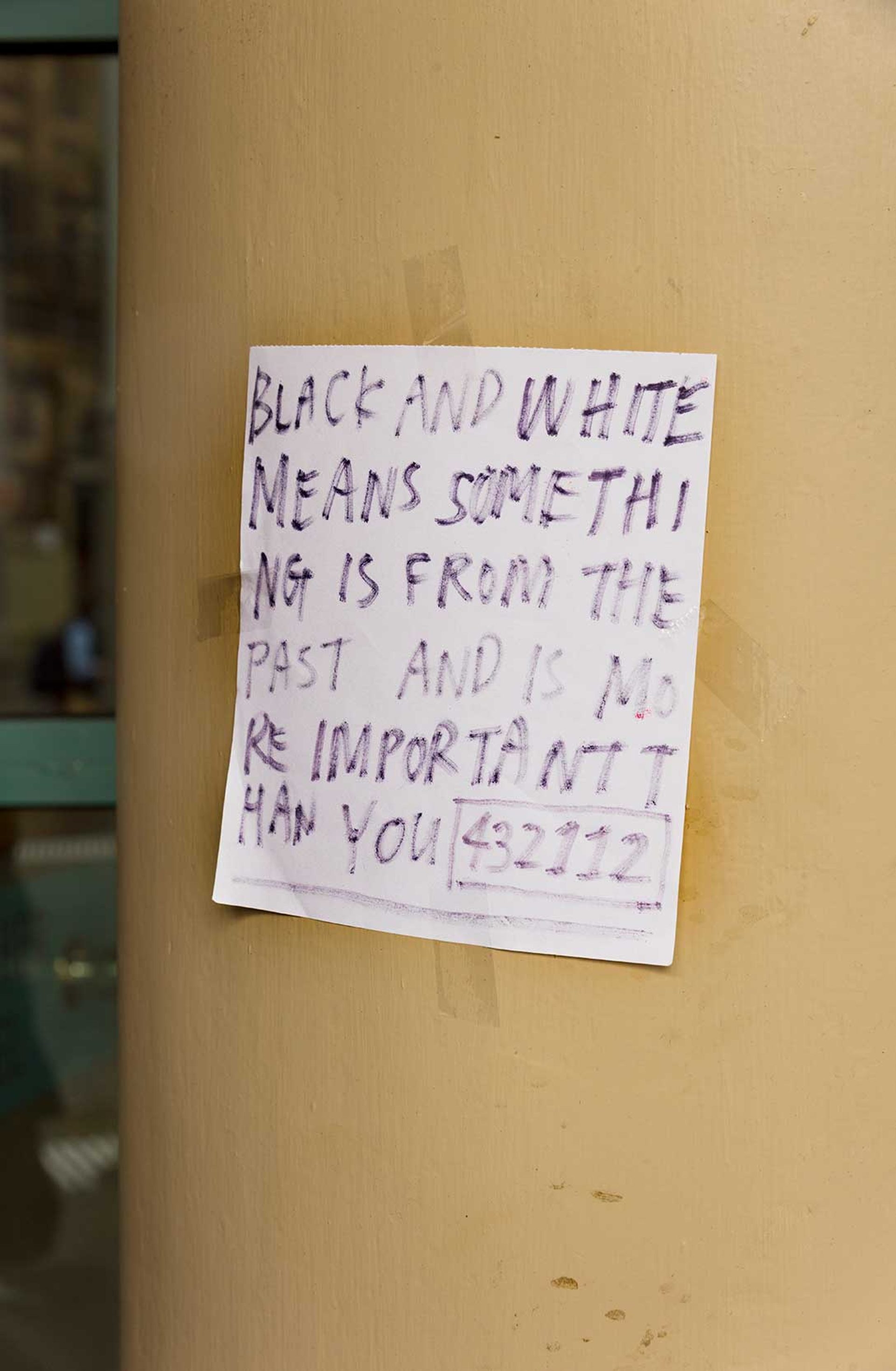 Note reading “BLACK AND WHITE MEANS SOMETHING IS FROM THE PAST AND IS MORE IMPORTANT THAN YOU 432112”