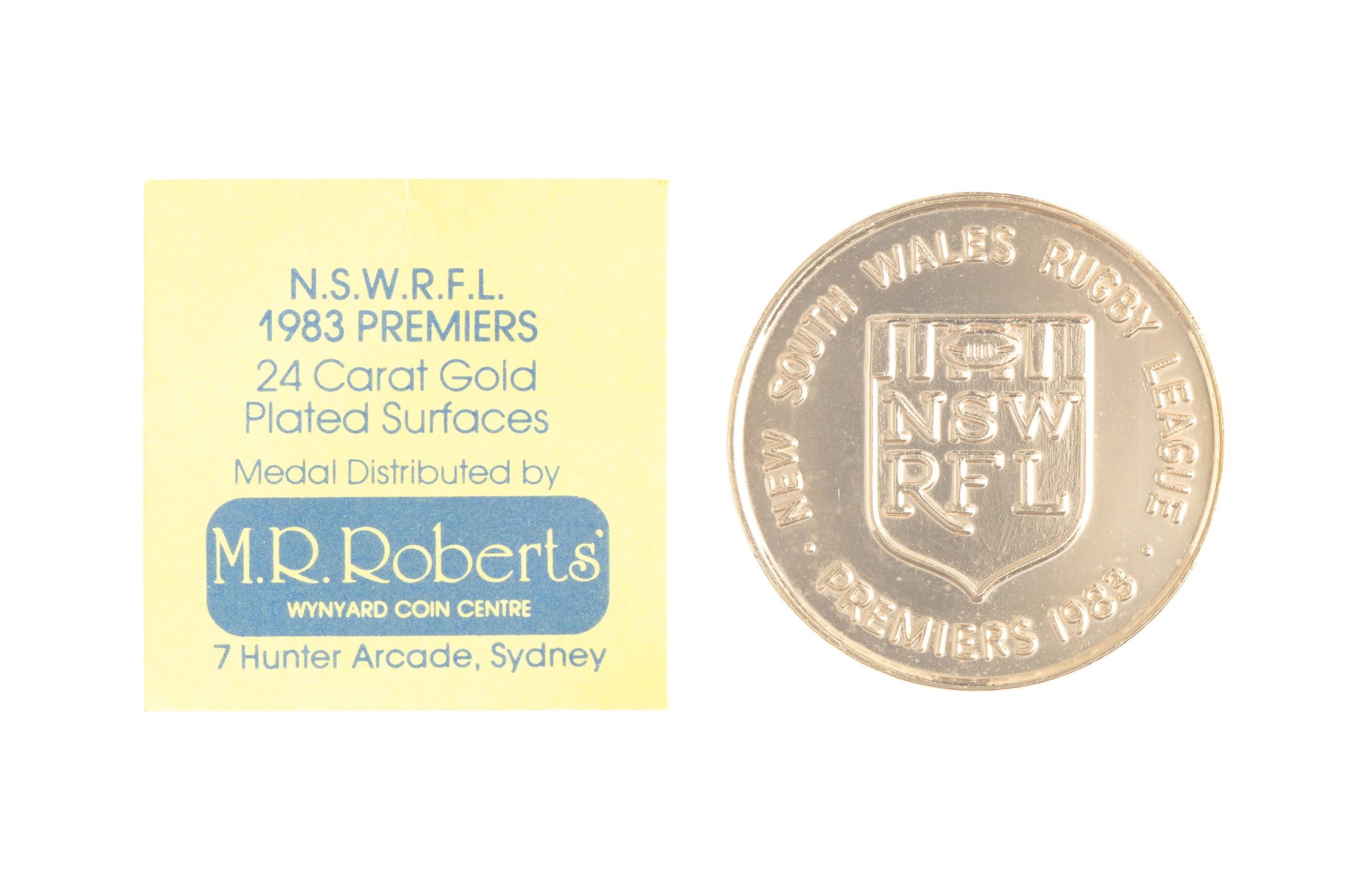 A medal with an eel design. Around the outer edge is the text 'Parramatta Eels'.