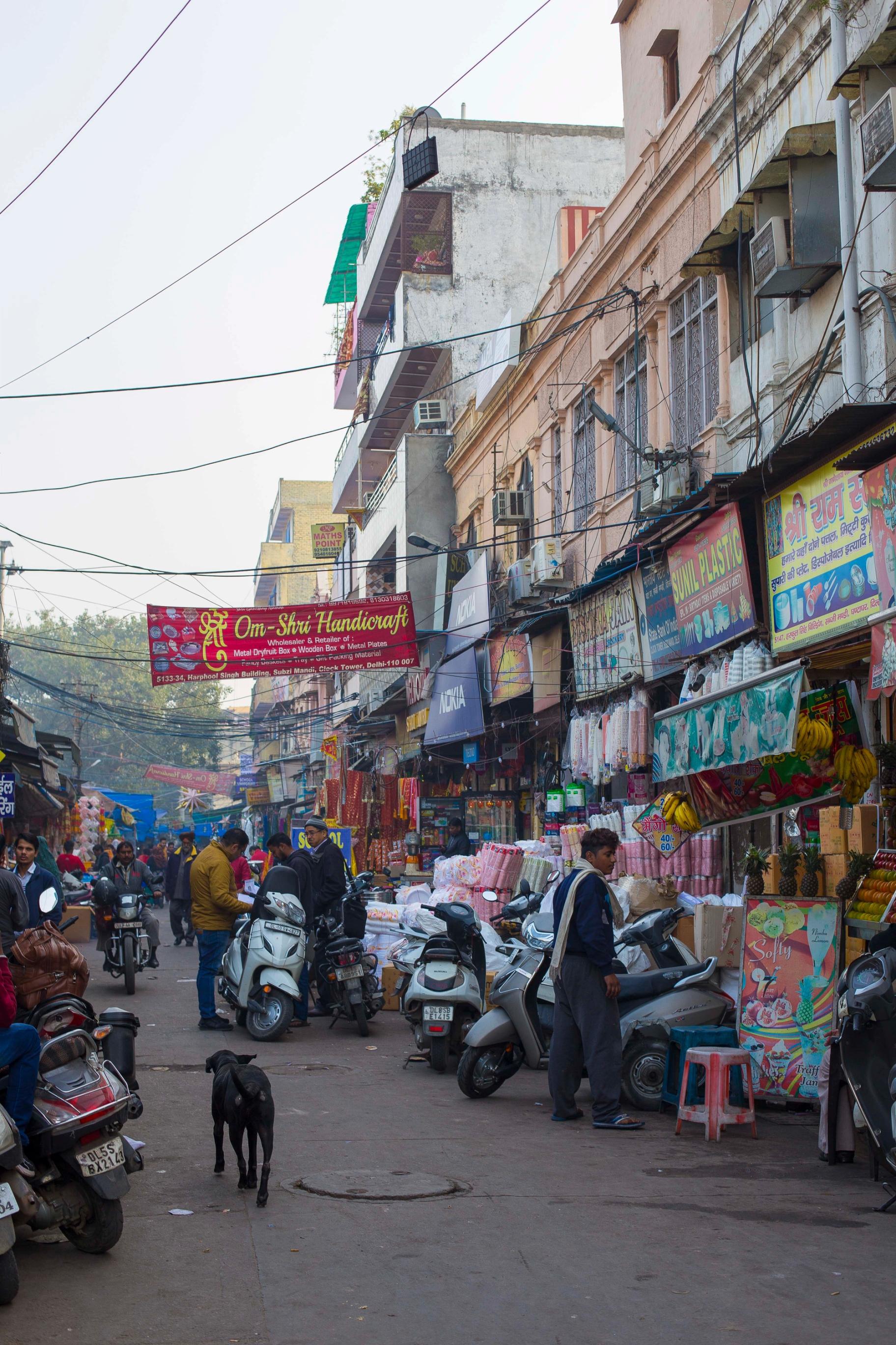 A bustling street market in urban India.