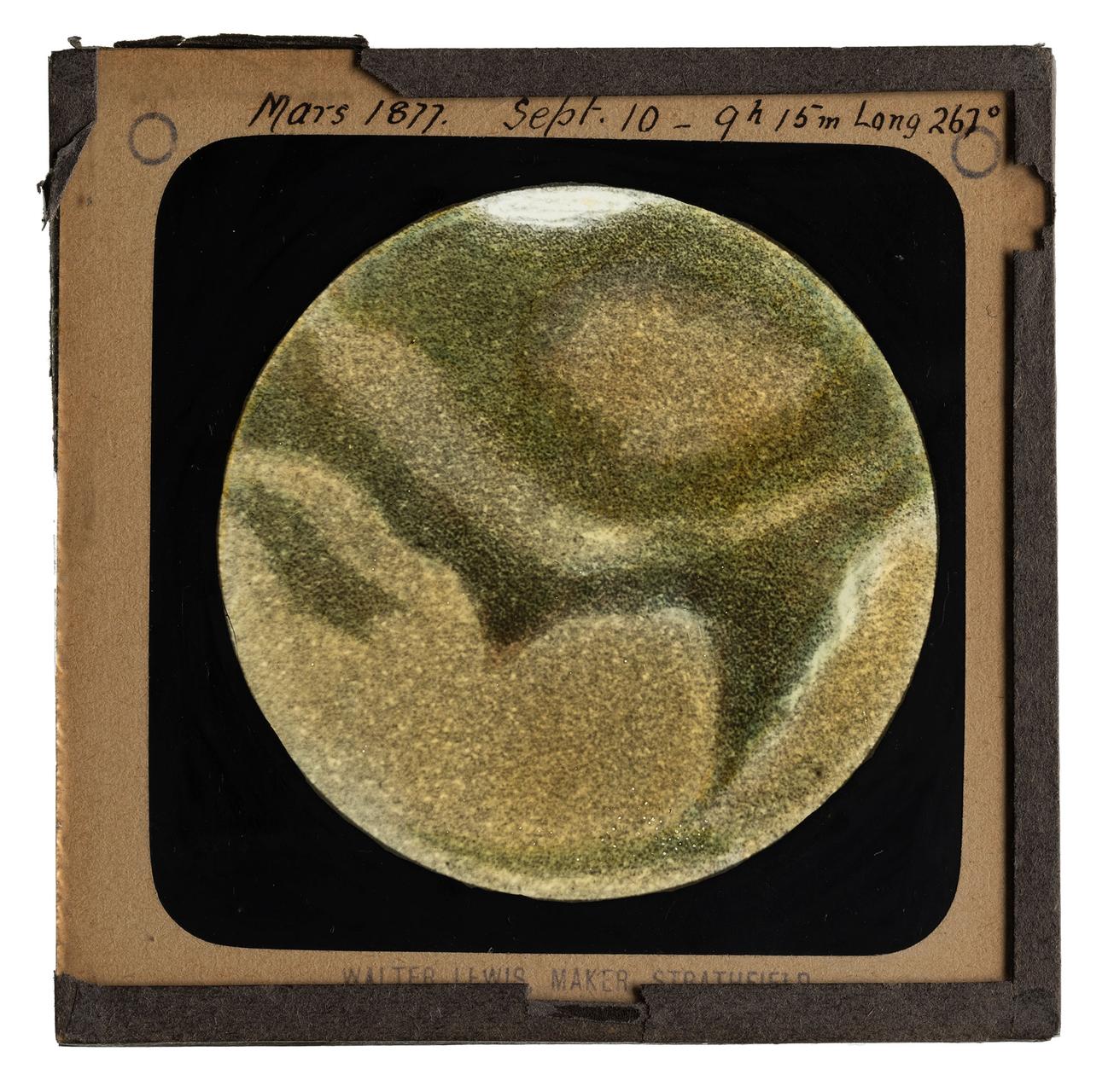 A green, brown and white drawing of Mars surrounded by a black border
