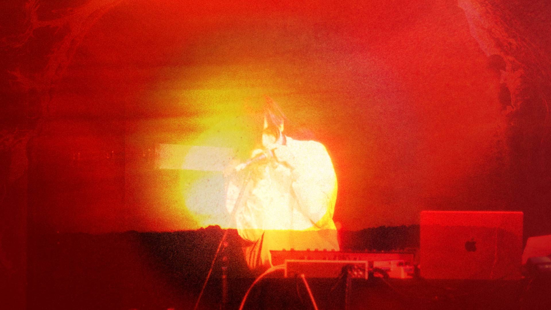 Photo bashed motion image with bright orange sunsets and natural textures over a silhouette of musician e fishpool.