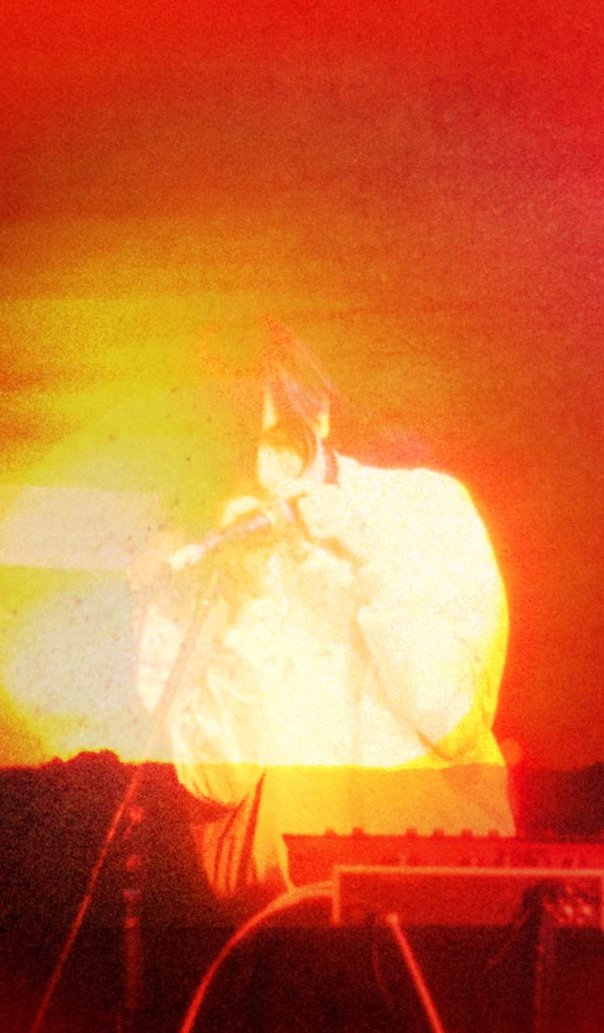 Photo bashed motion image with bright orange sunsets and natural textures over a silhouette of musician e fishpool.