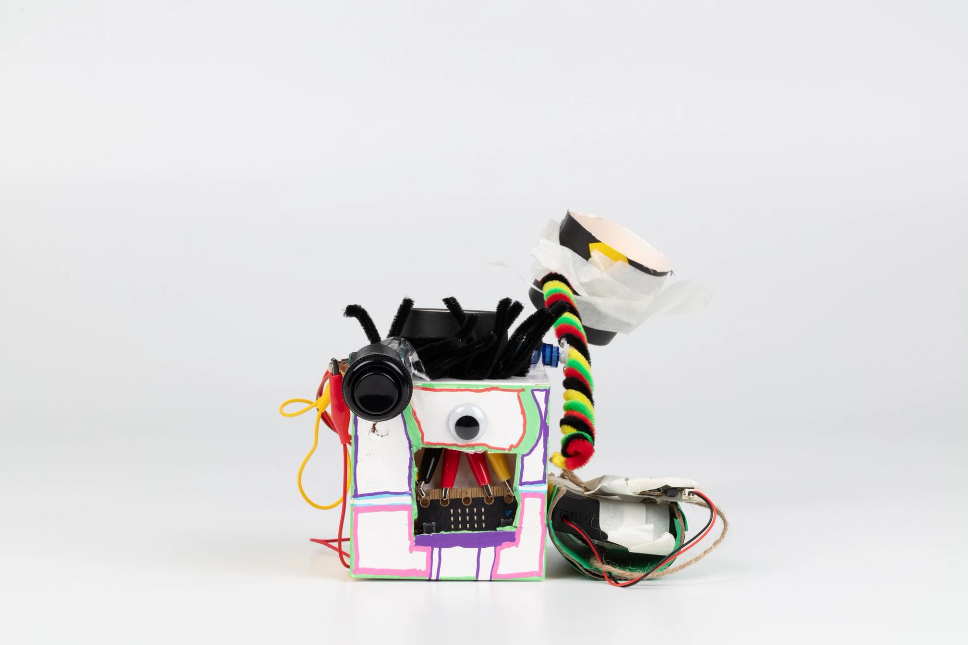 Image of a hand crafted mechanical device against a white background.