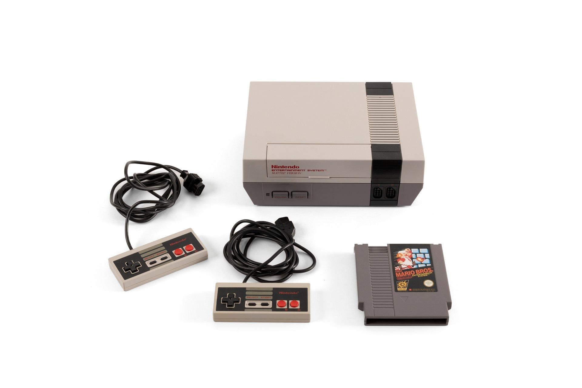 Nintendo Entertainment System console with two controllers and a game cartridge with text 'Super Mario Bros. Nintendo Entertainment System