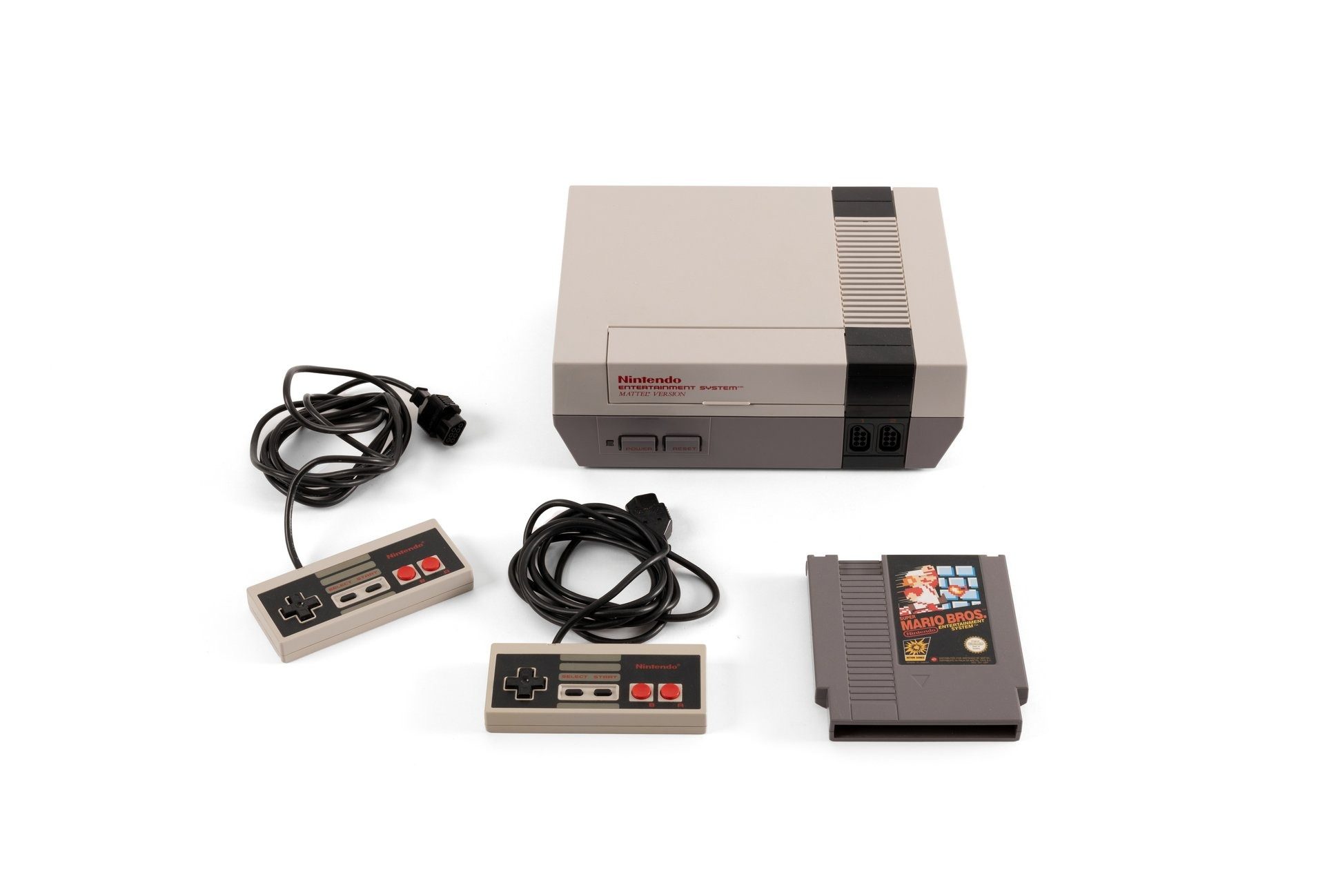 Nintendo Entertainment System console with two controllers and a game cartridge with text 'Super Mario Bros. Nintendo Entertainment System