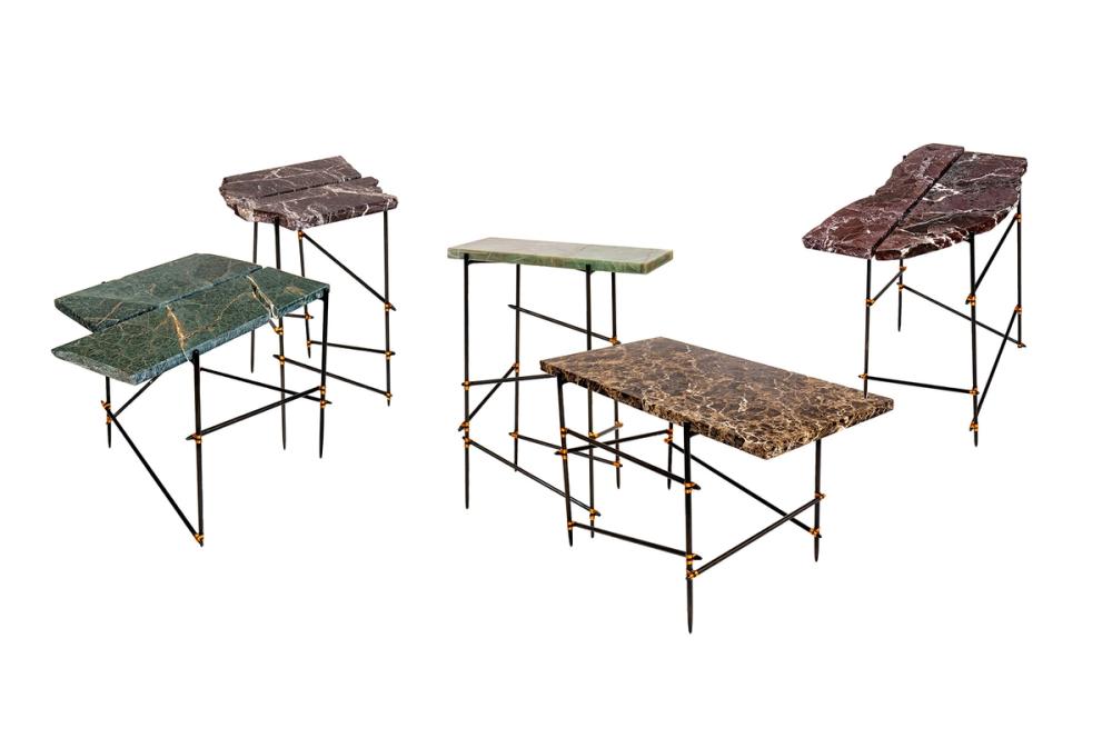 a series of tables with marble tops in various shapes and colours and black bar legs.