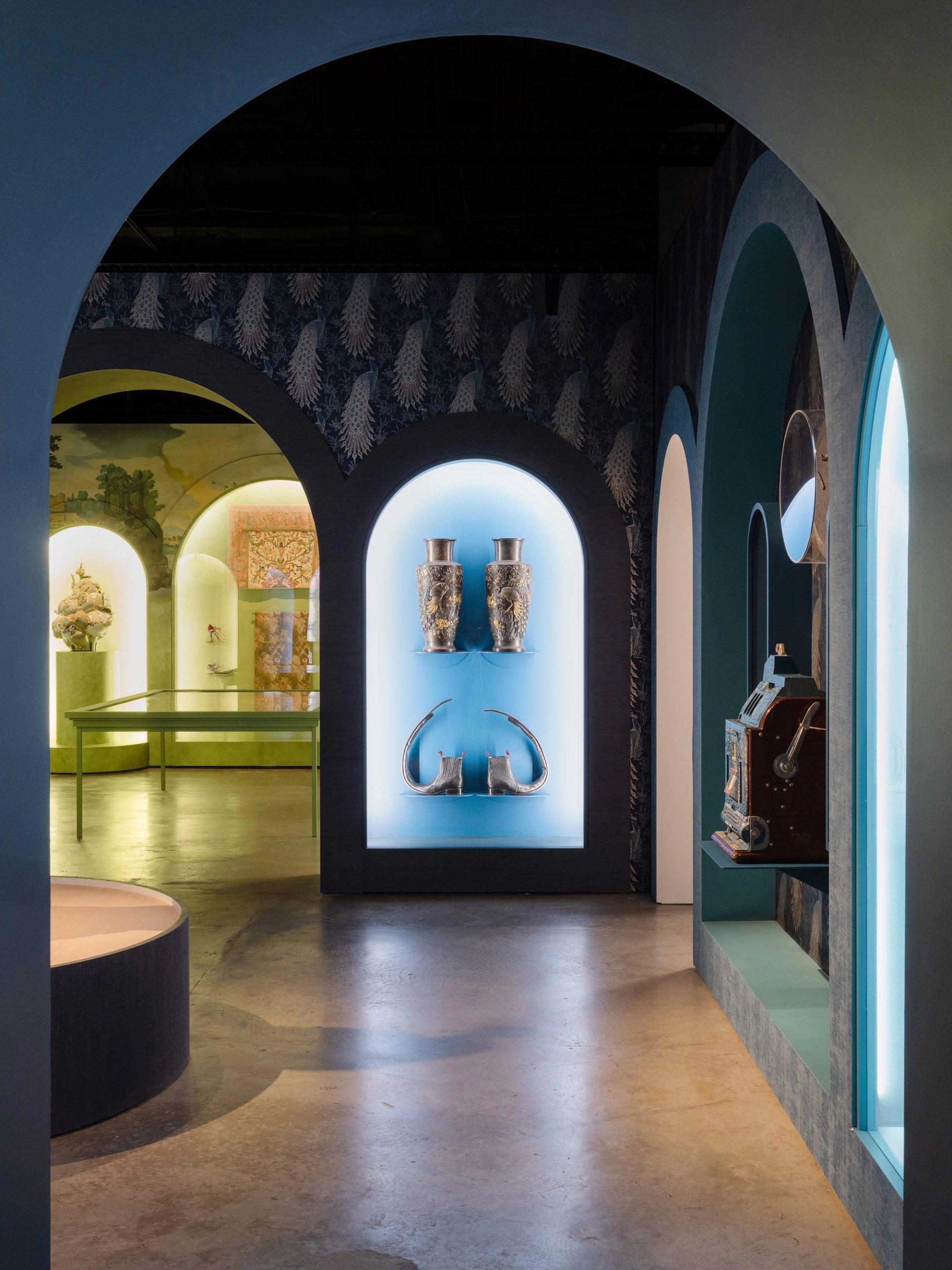 Exhibition with arches through to other rooms.