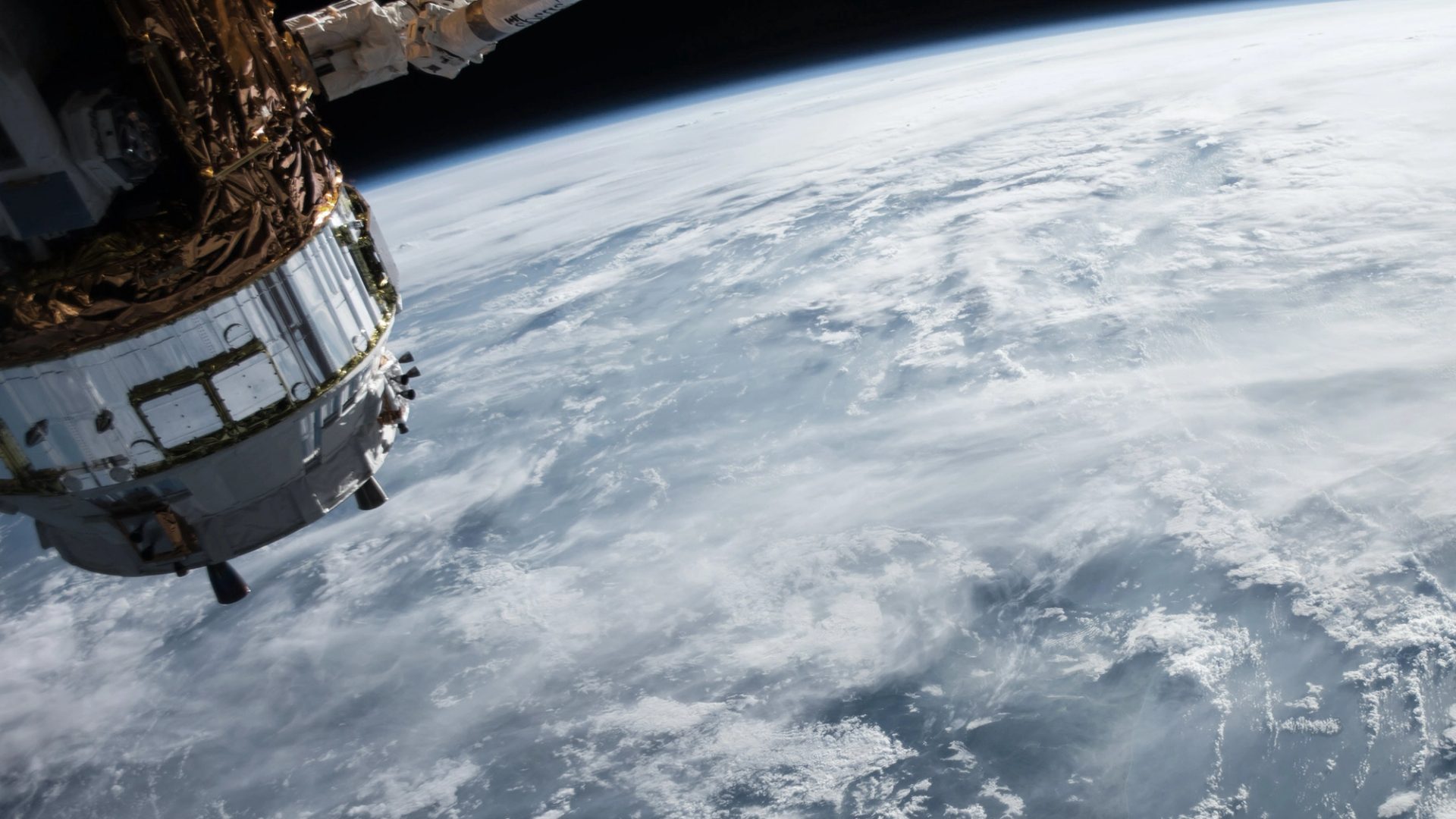 ocean and clouds on earth and satellite taken from space