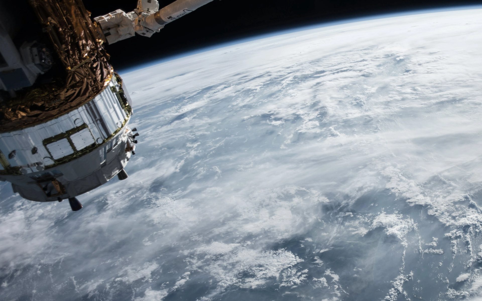 ocean and clouds on earth and satellite taken from space