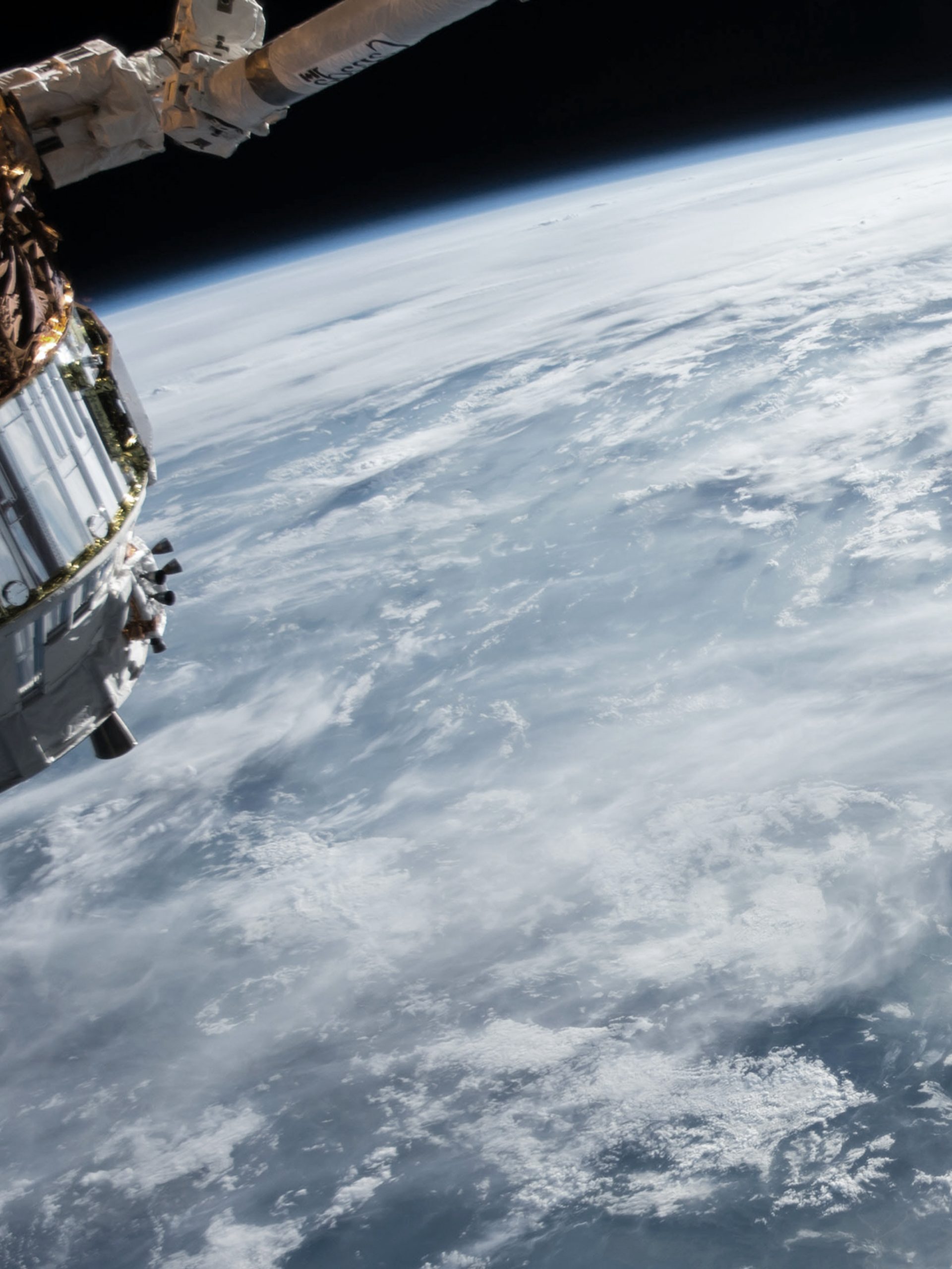 ocean and clouds on earth and satellite taken from space