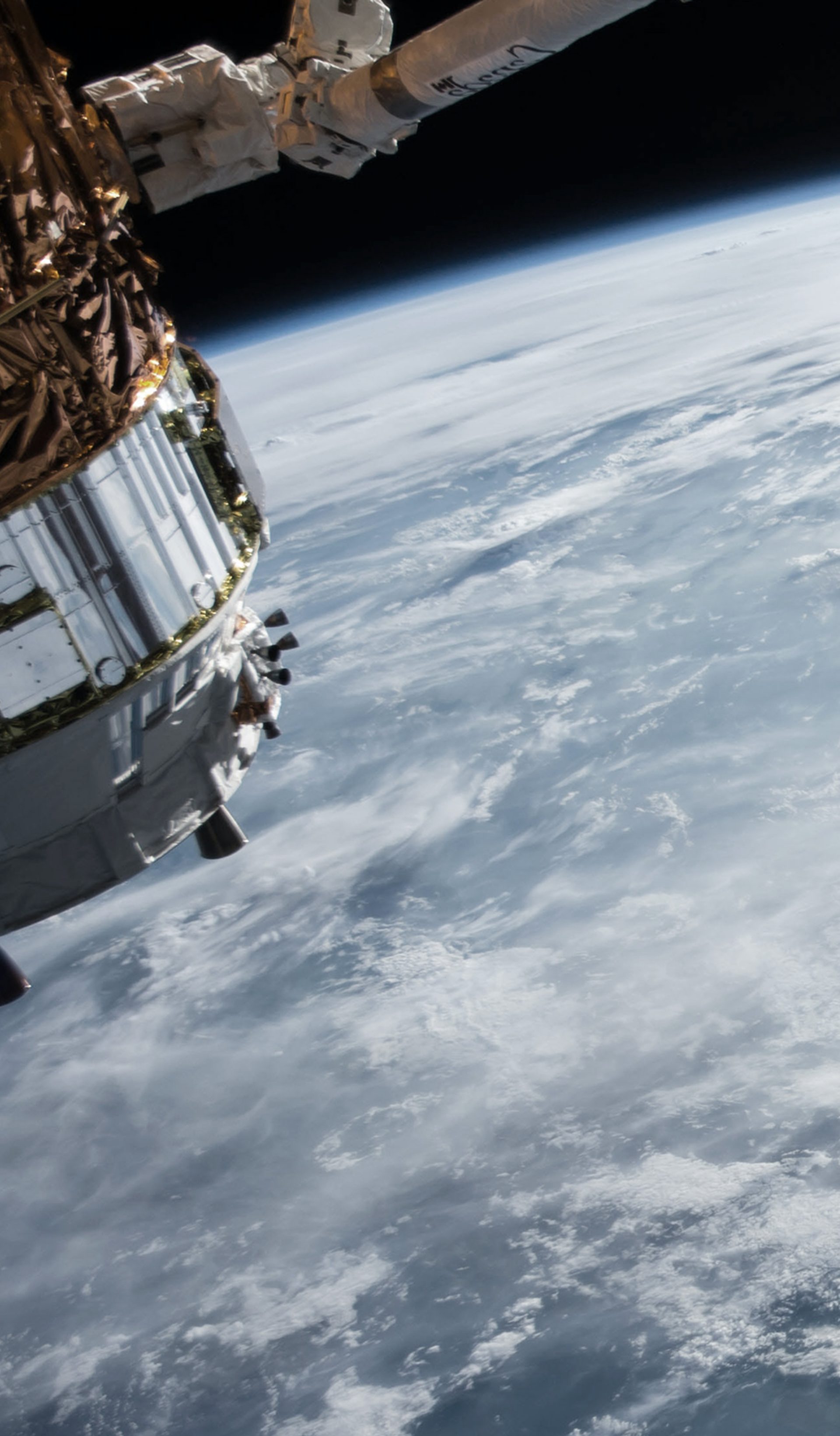ocean and clouds on earth and satellite taken from space
