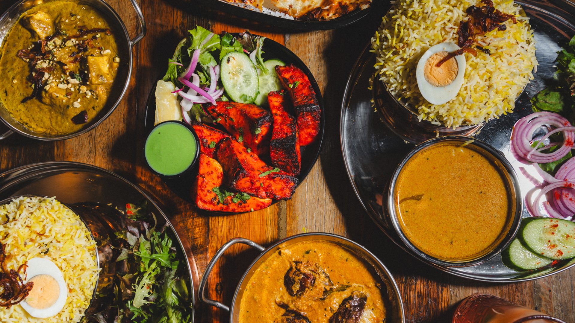 Table filled with plates of food.