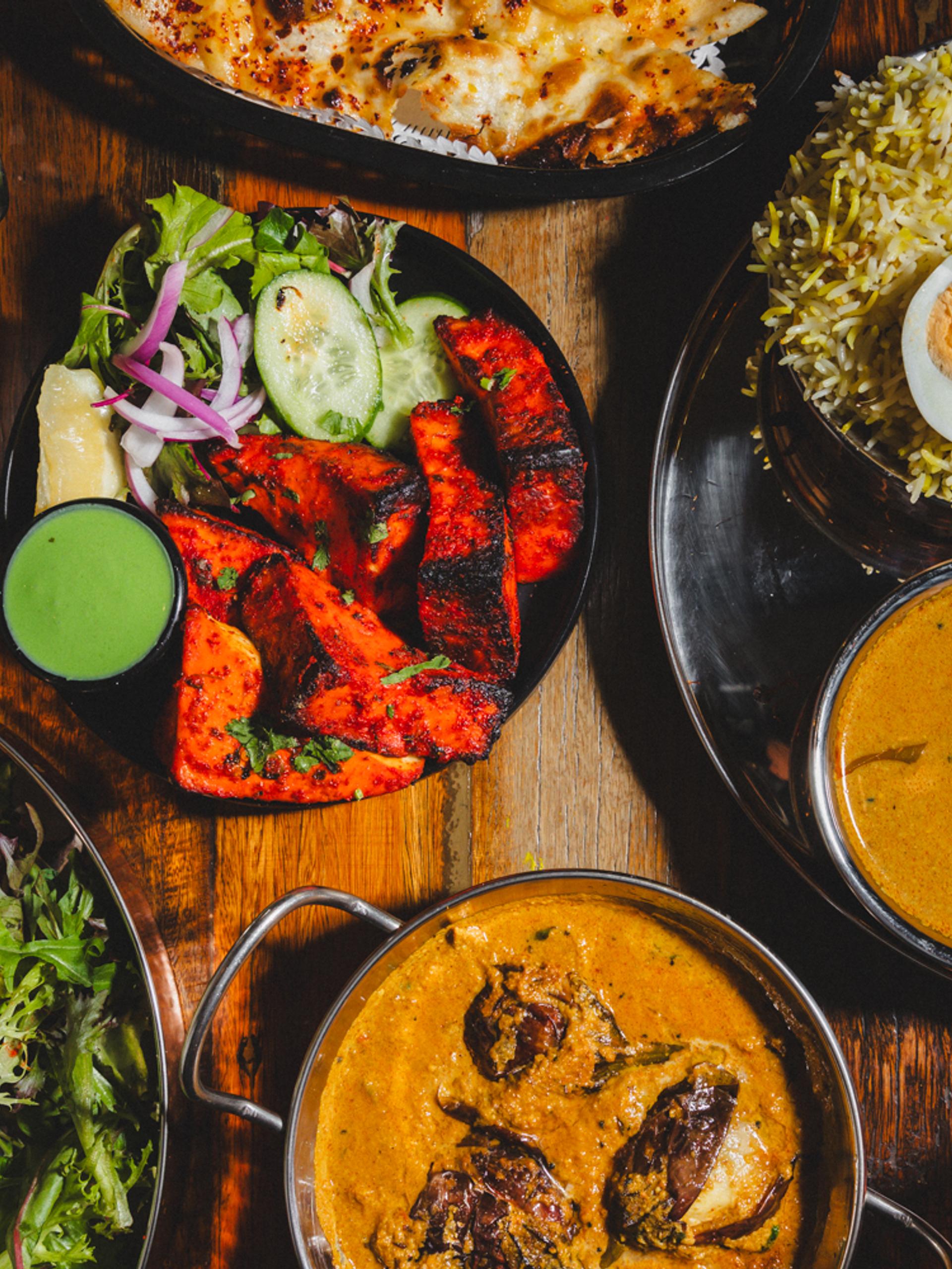 Table filled with plates of food.